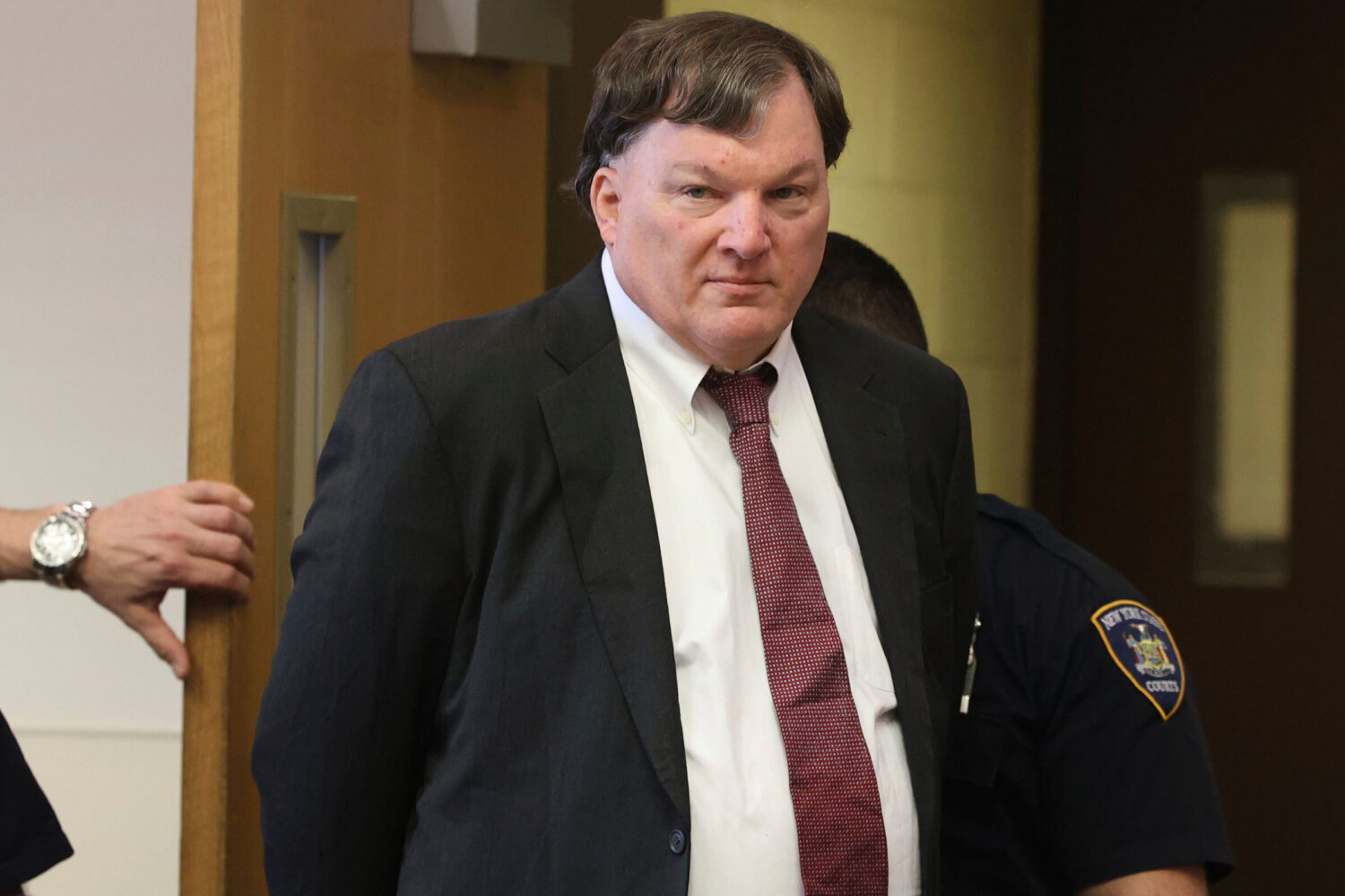FILE - Rex Heuermann, charged in a string of deaths known as the Gilgo Beach killings, appears in J...