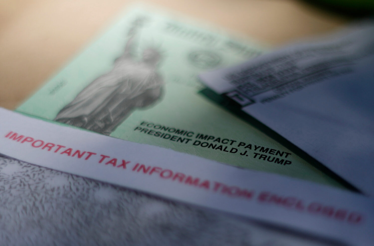 FILE - President Donald J. Trump's name is printed on a stimulus check issued by the IRS to help co...