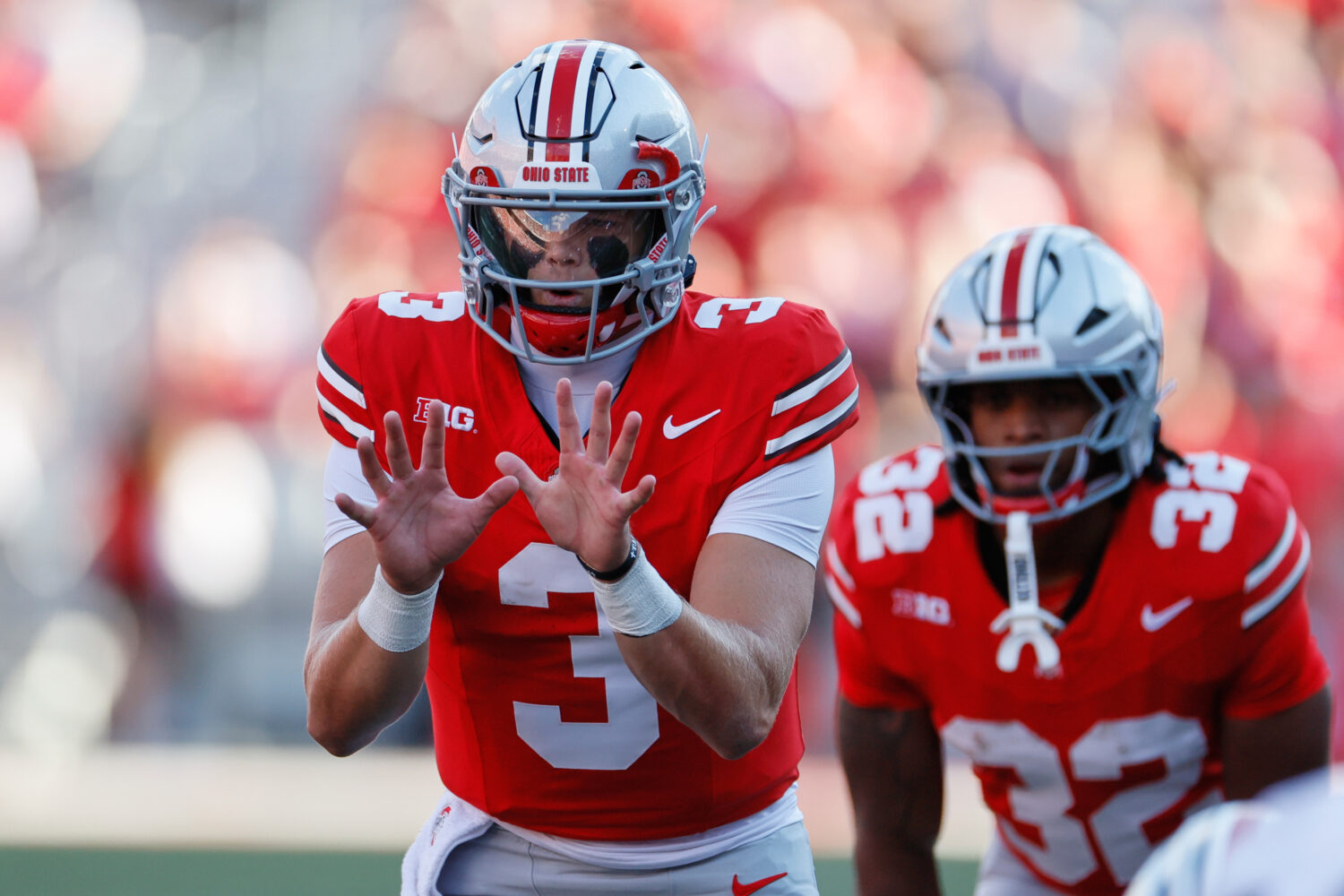 Ohio State quarterback Lincoln Kienholz takes a snap against Grambling State during the second half...