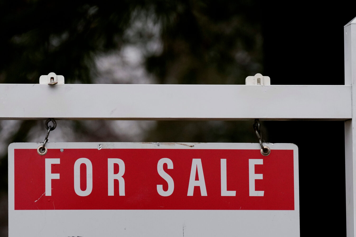FILE - A for sale sign stands outside a residence in Wheeling, Ill., Dec. 16, 2024. (AP Photo/Nam Y...