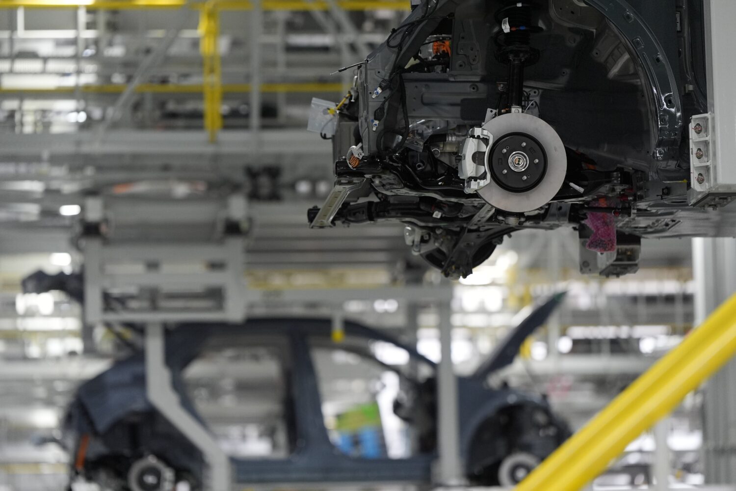 FILE - Vehicles move on the line at the Hyundai Motor Group Metaplant America, March 26, 2025, in E...