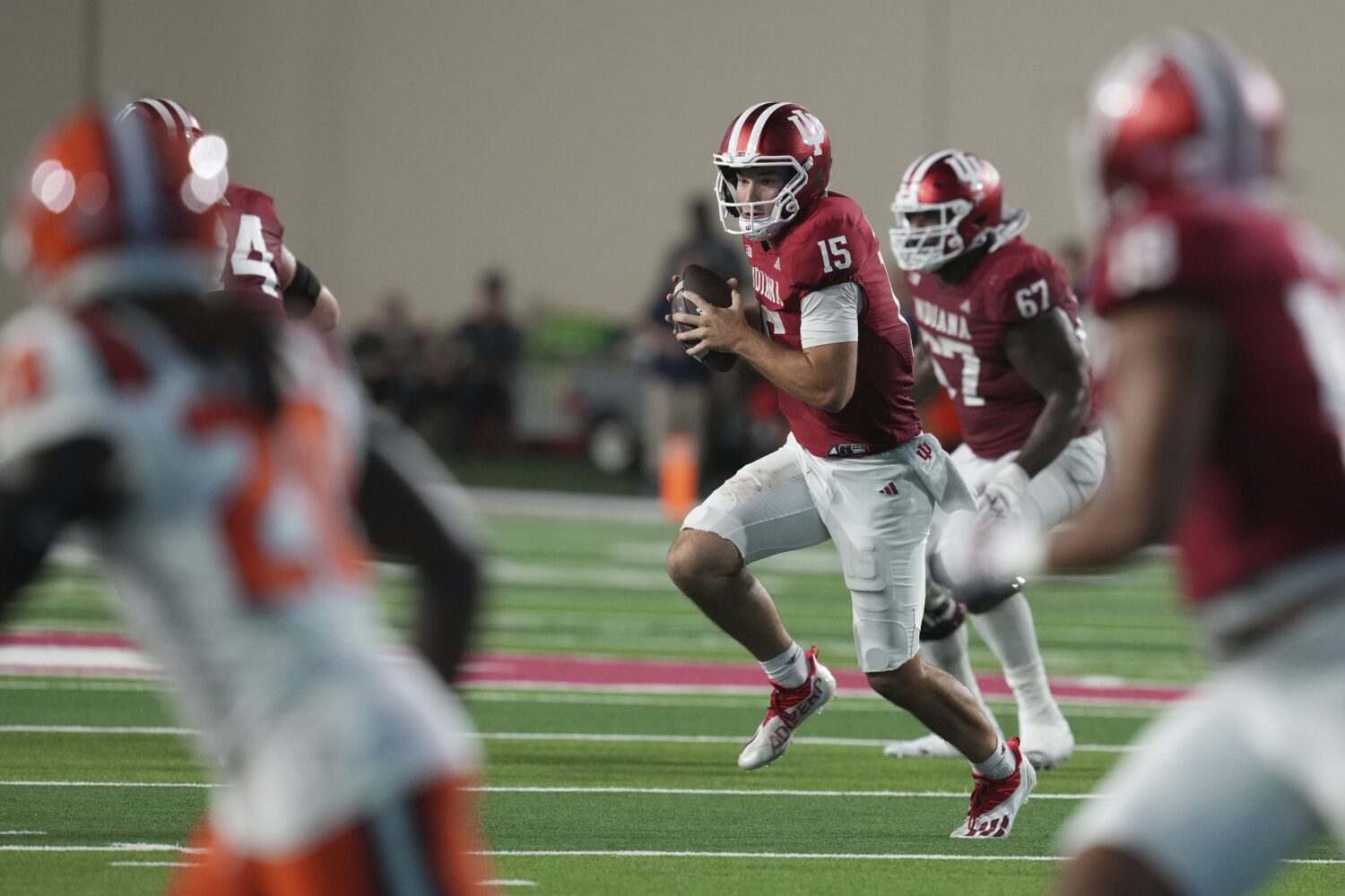Indiana quarterback Fernando Mendoza (15) runs during the second half of an NCAA college football g...