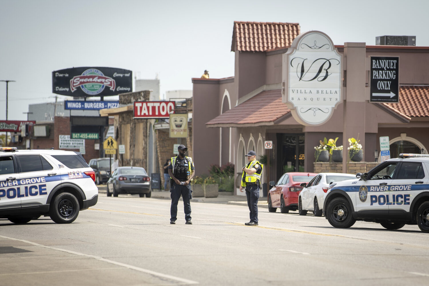Law enforcement personnel investigate after the Department of Homeland Security said an Immigration...