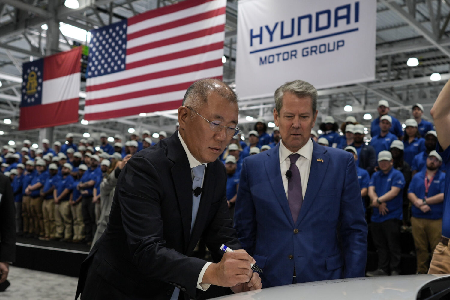 FILE - Euisun Chung, Executive Chair, Hyundai Motor Company, left, stands with Georgia Gov. Brian K...