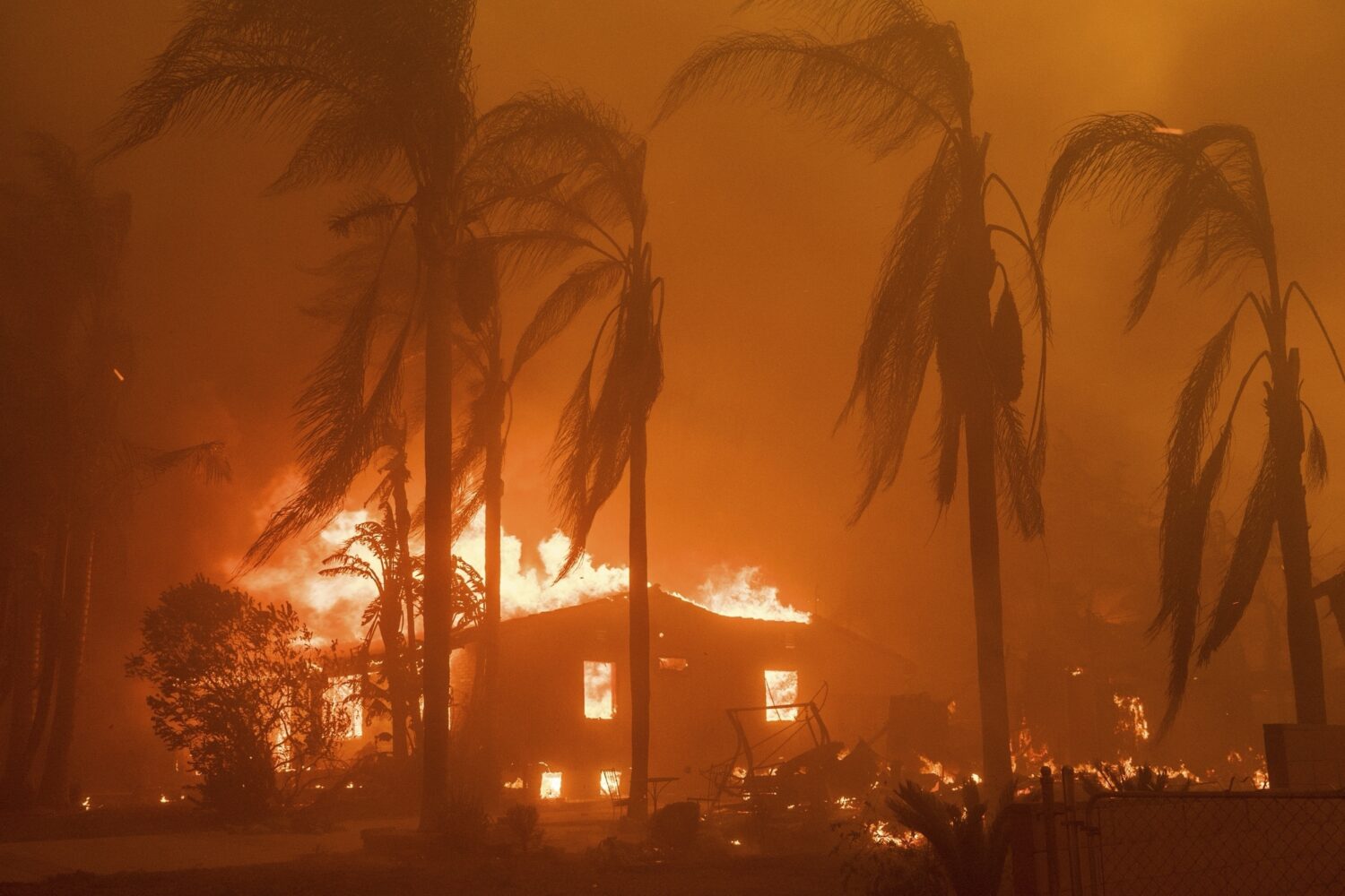 FILE - A home burns in the Eaton Fire in Altadena, Calif., Jan. 8, 2025. (AP Photo/Nic Coury, File)...