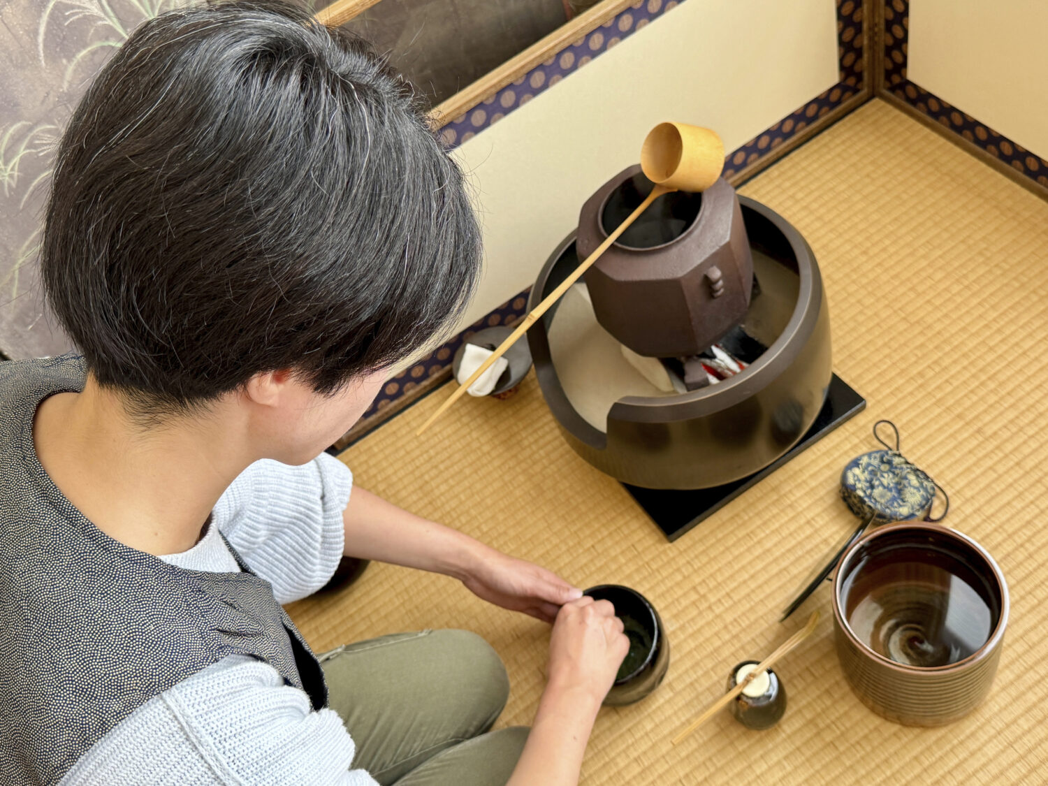 Anri Frank, practices making matcha during a traditional Japanese tea service class, Monday, Sept. ...