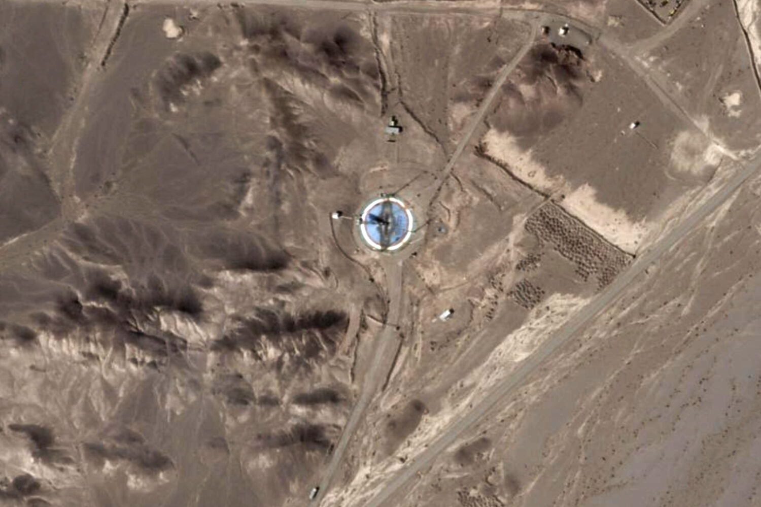 This satellite photo from Planet Labs PBC shows a scorched launch pad at Iran's Imam Khomeini Space...