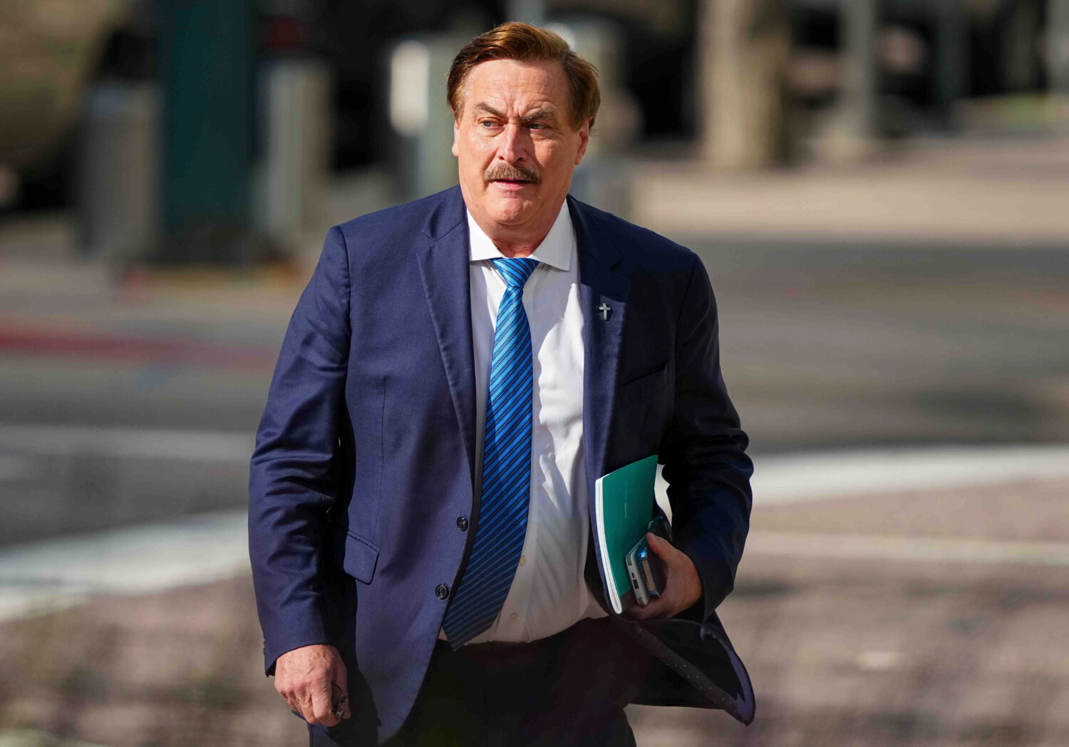 FILE - Mike Lindell walks into federal district court for a defamation trial, June 5, 2025, in Denv...