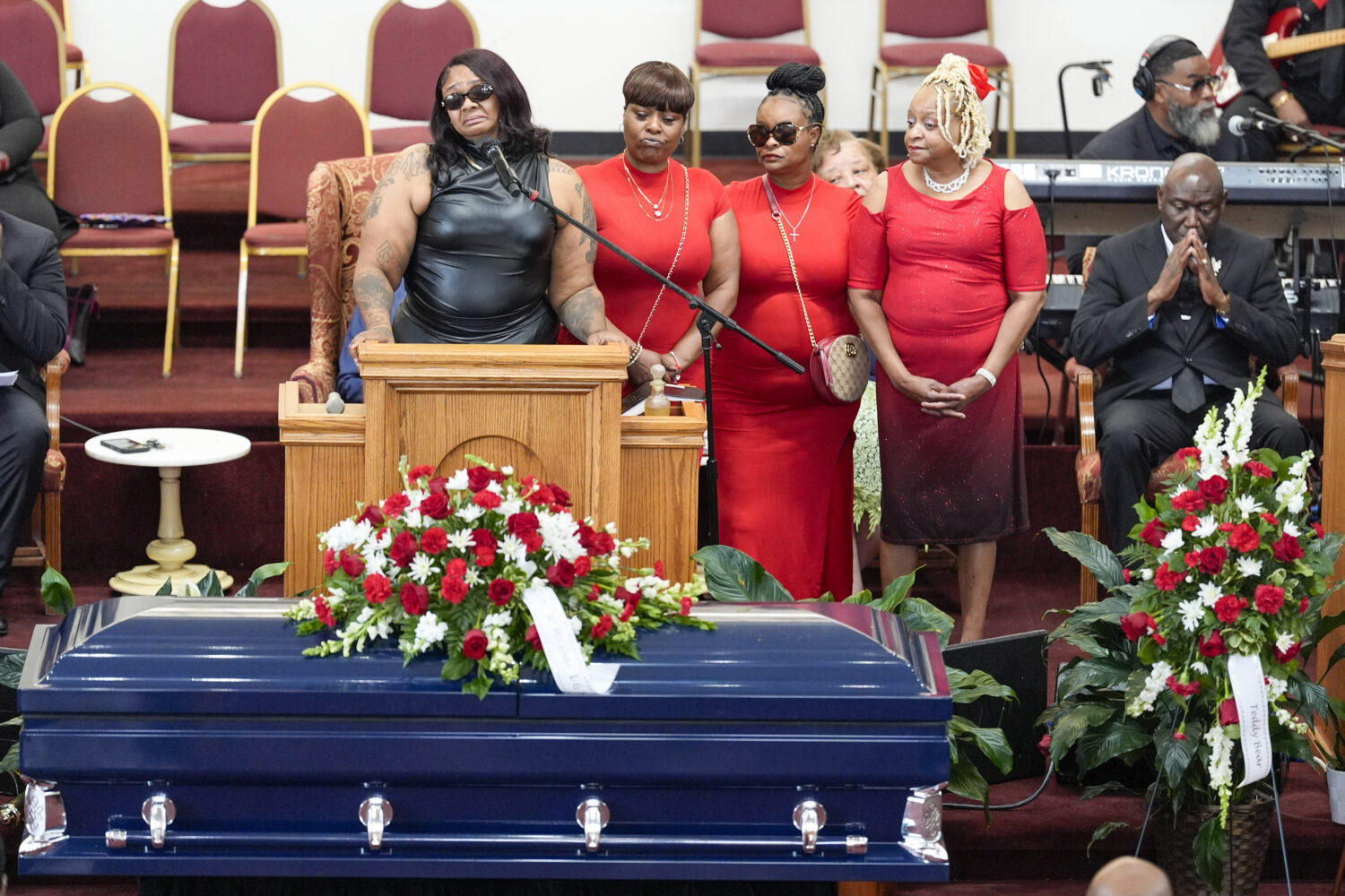 FILE - DeAsia Harmon speaks at the funeral for her husband D'Vontaye Mitchell, July 11, 2024, in Mi...