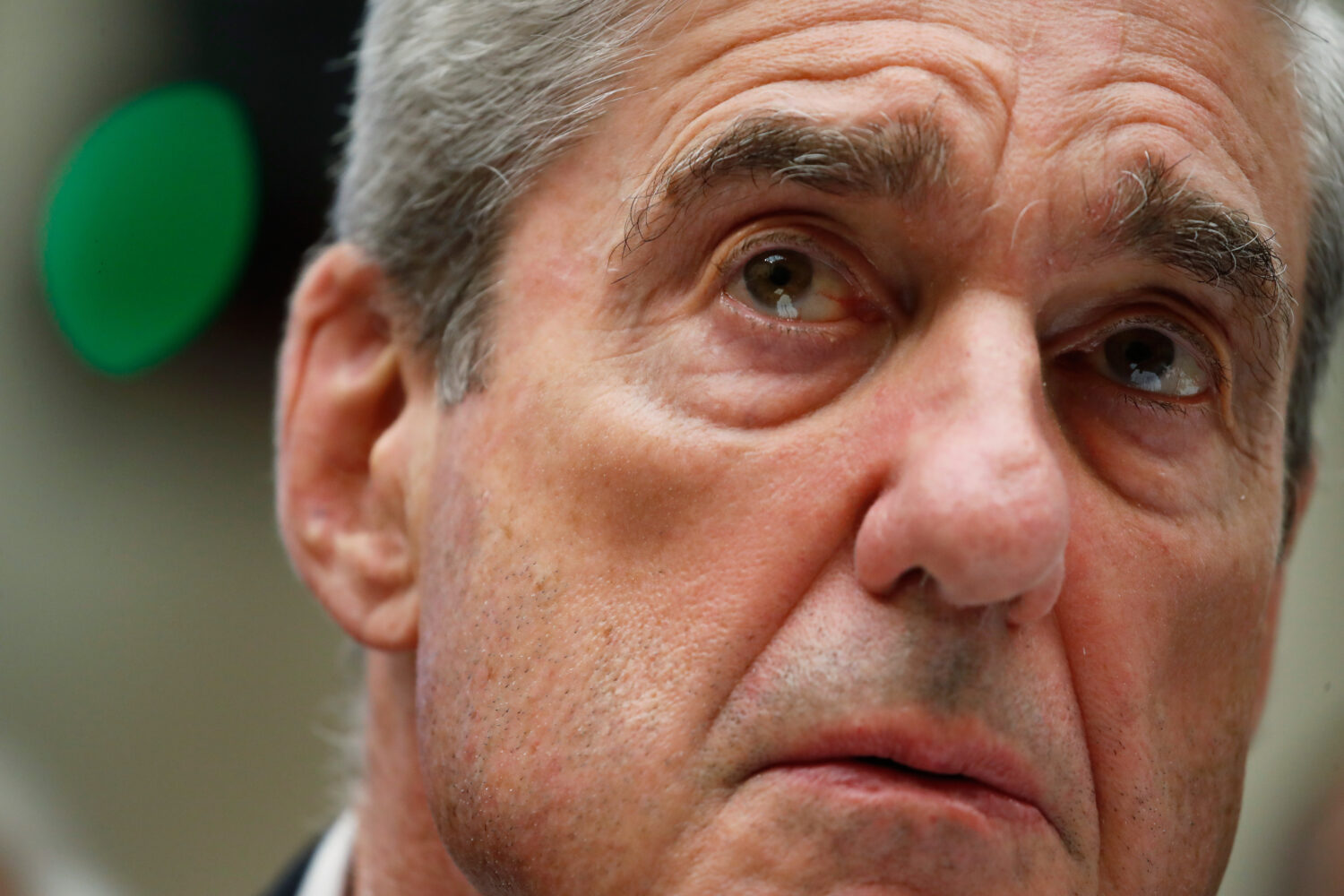 FILE - Former special counsel Robert Mueller testifies before the House Intelligence Committee hear...