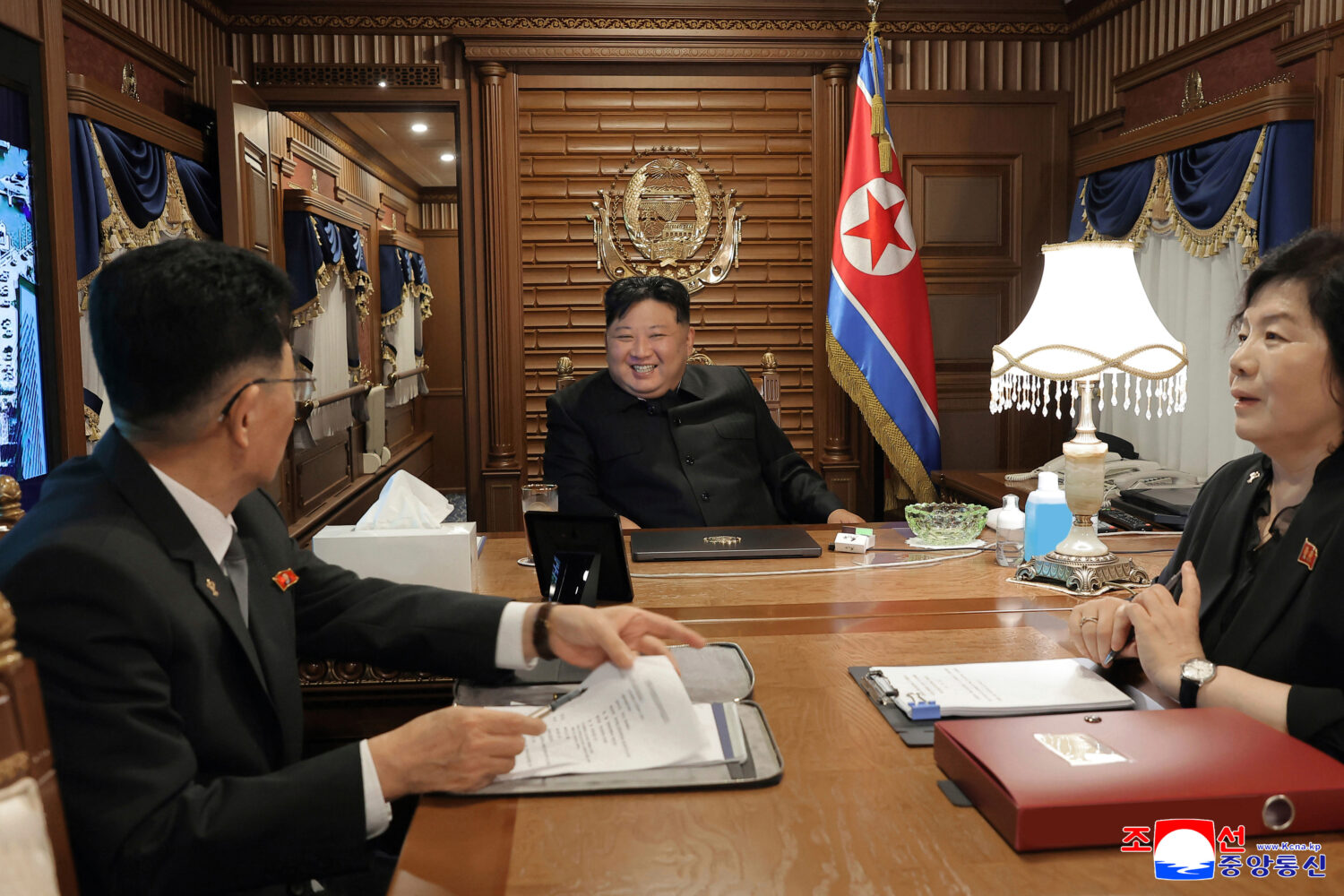 In this photo provided by the North Korean government, North Korean leader Kim Jong Un, center, lea...