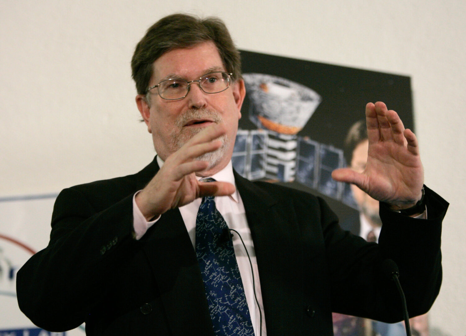 FILE - Dr. George Smoot, professor of Physics at the University of California Berkeley, gestures du...