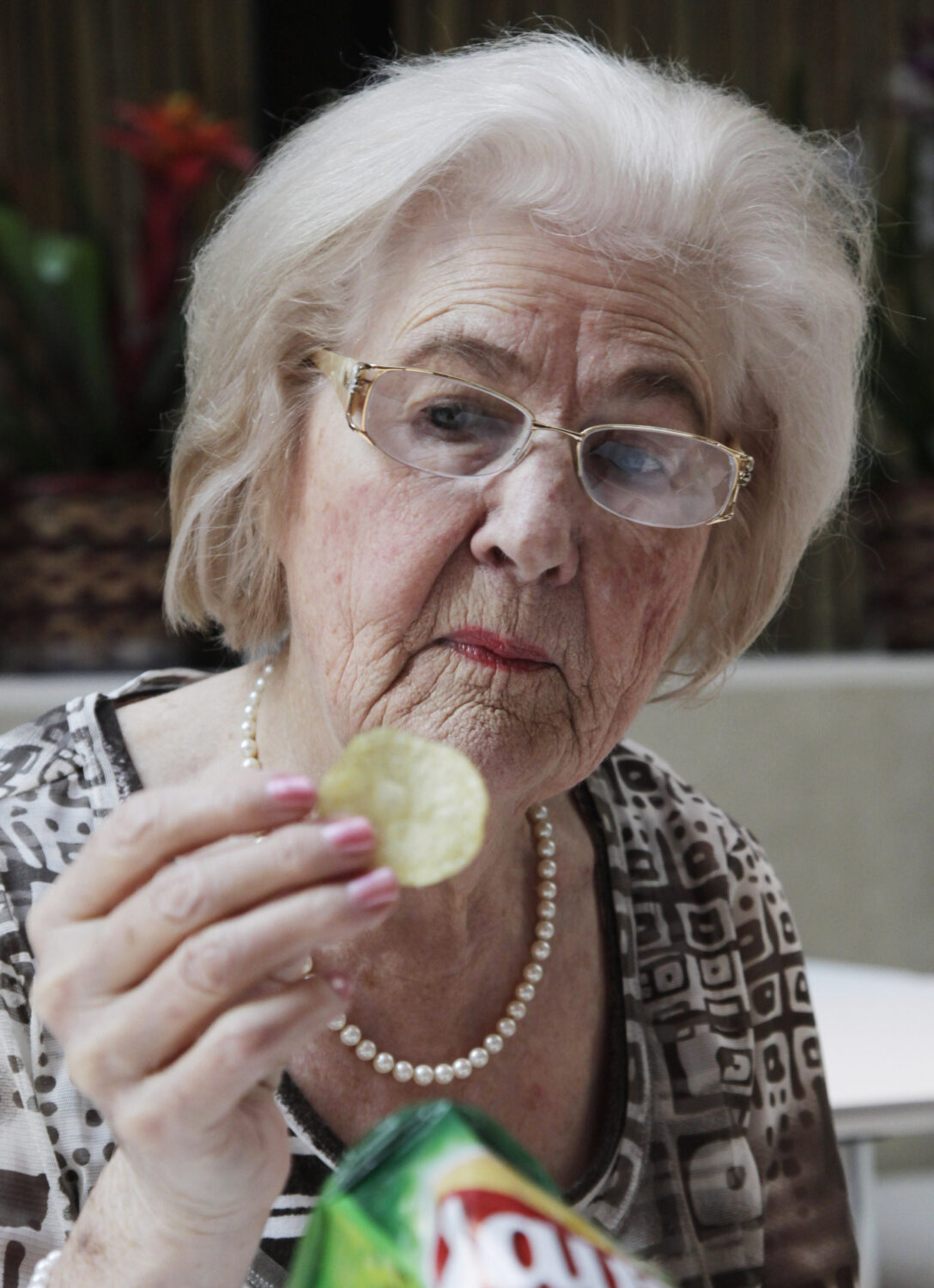 FILE - In this March 14, 2012 file photo, Marilyn Hagerty samples a Lays potato chip during an inte...