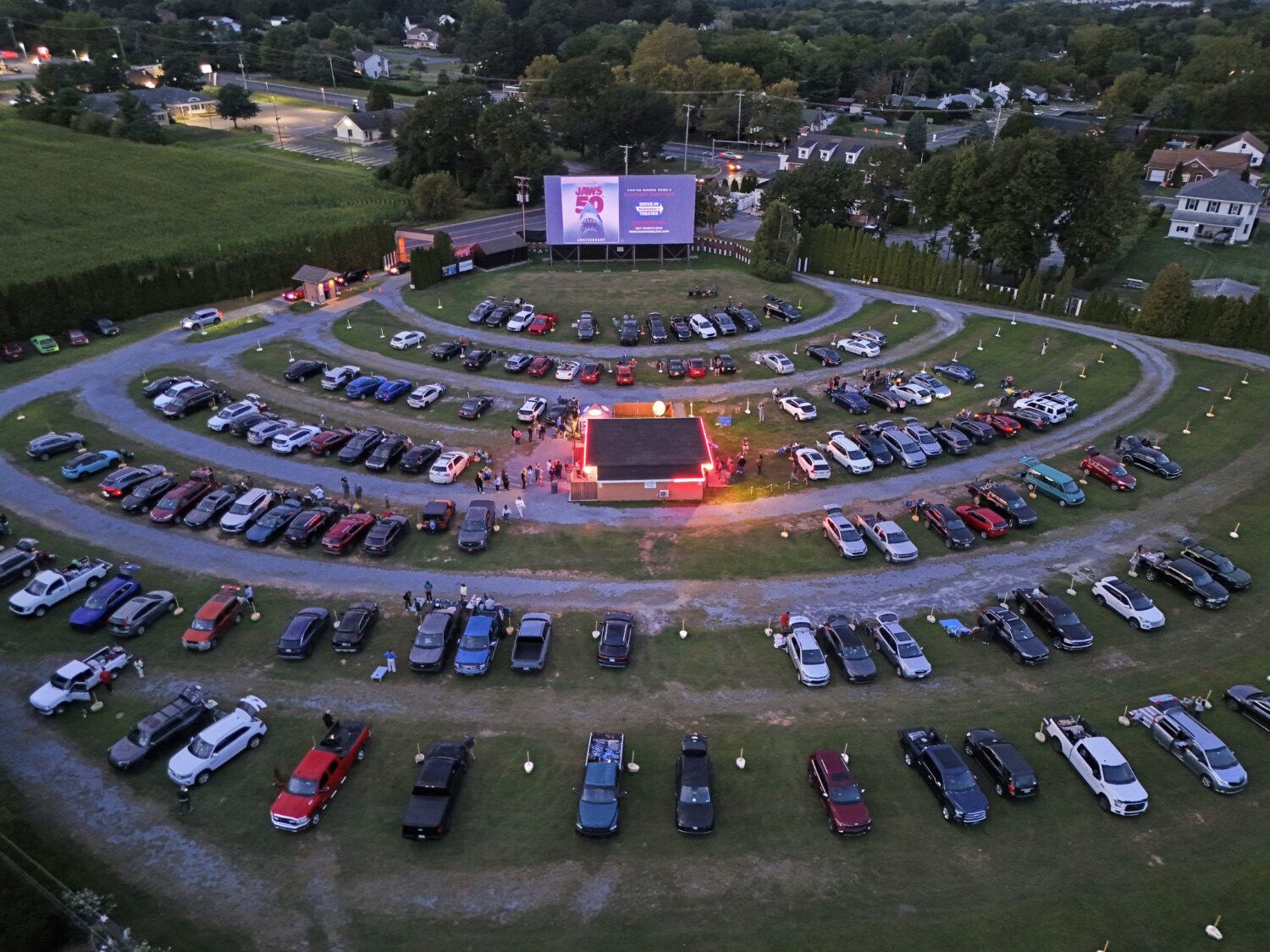 The sunsets on the Shankweiler Drive-In as previews run before the feature film "Jaws" in Orefield,...