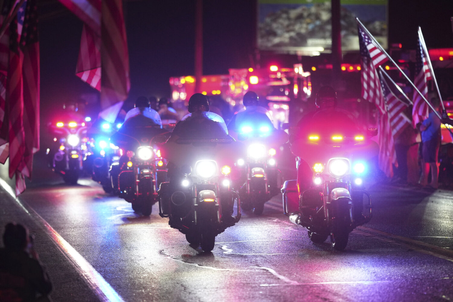 Police officers ride during a procession Wednesday, Sept. 17, 2025, in Spring Grove, Pa., after mul...