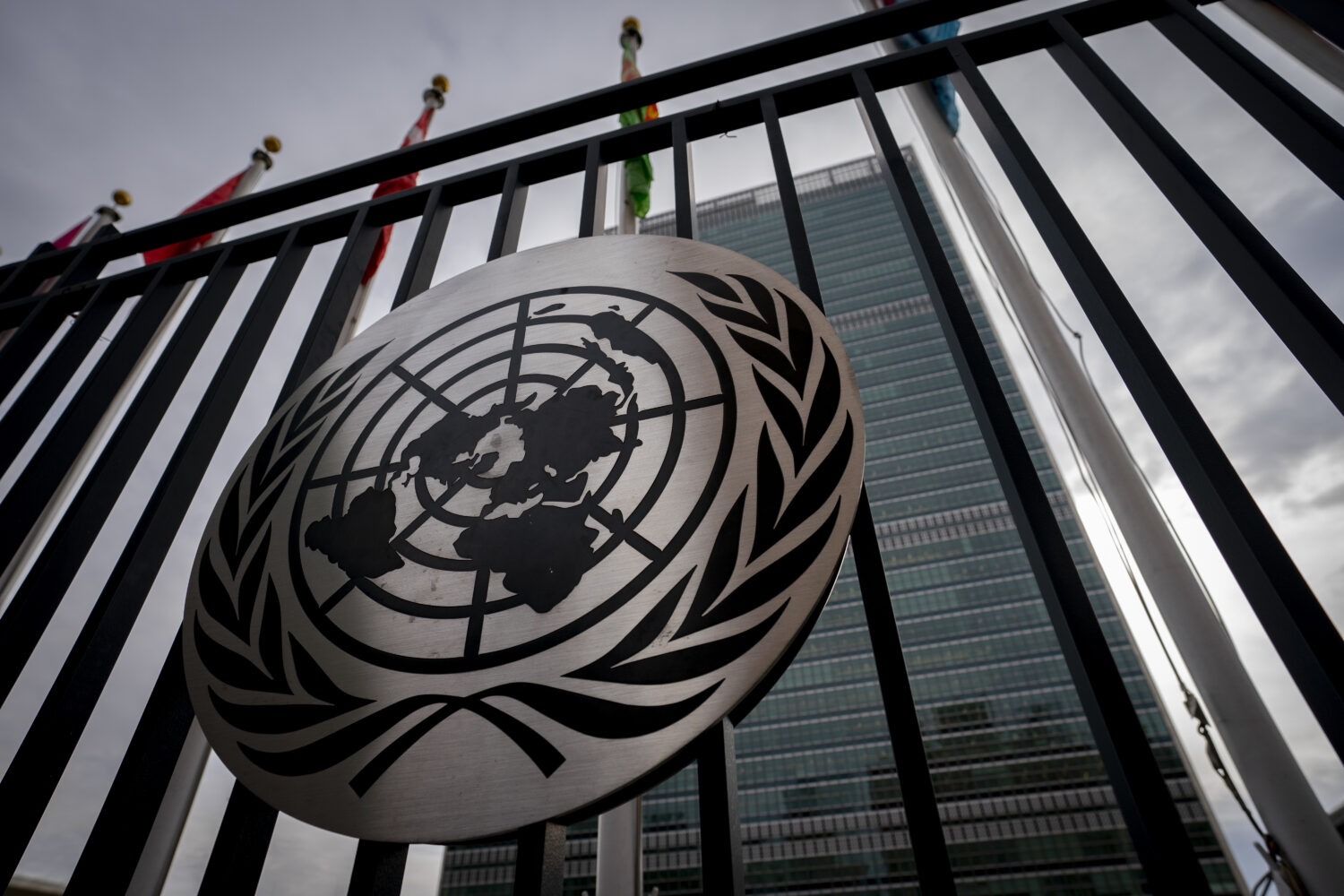 FILE - The symbol of the United Nations is displayed on the main gate outside UN headquarters, Feb....