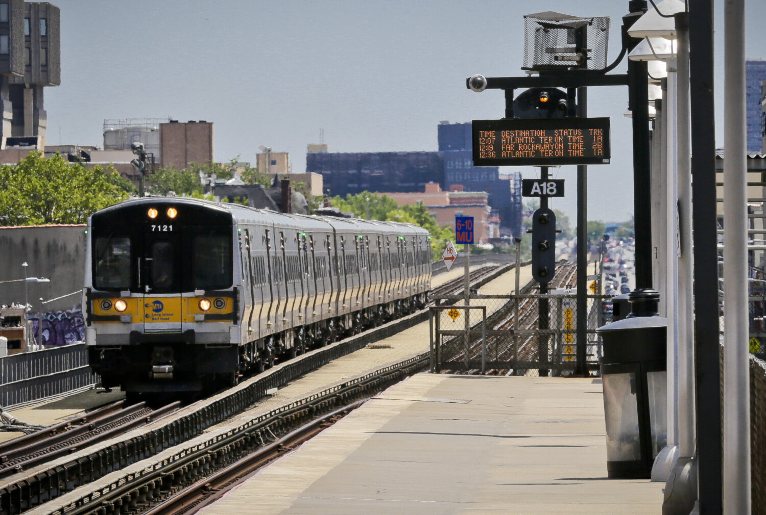FILE - An Atlantic Terminal bound LIRR train arrives at the Nostrand Avenue station, July 9, 2017, ...