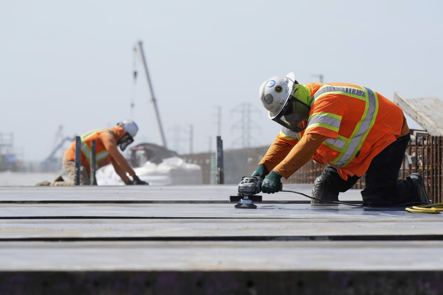 FILE - Ironworkers with the California High-Speed Rail Authority work on the Hanford Viaduct, April...