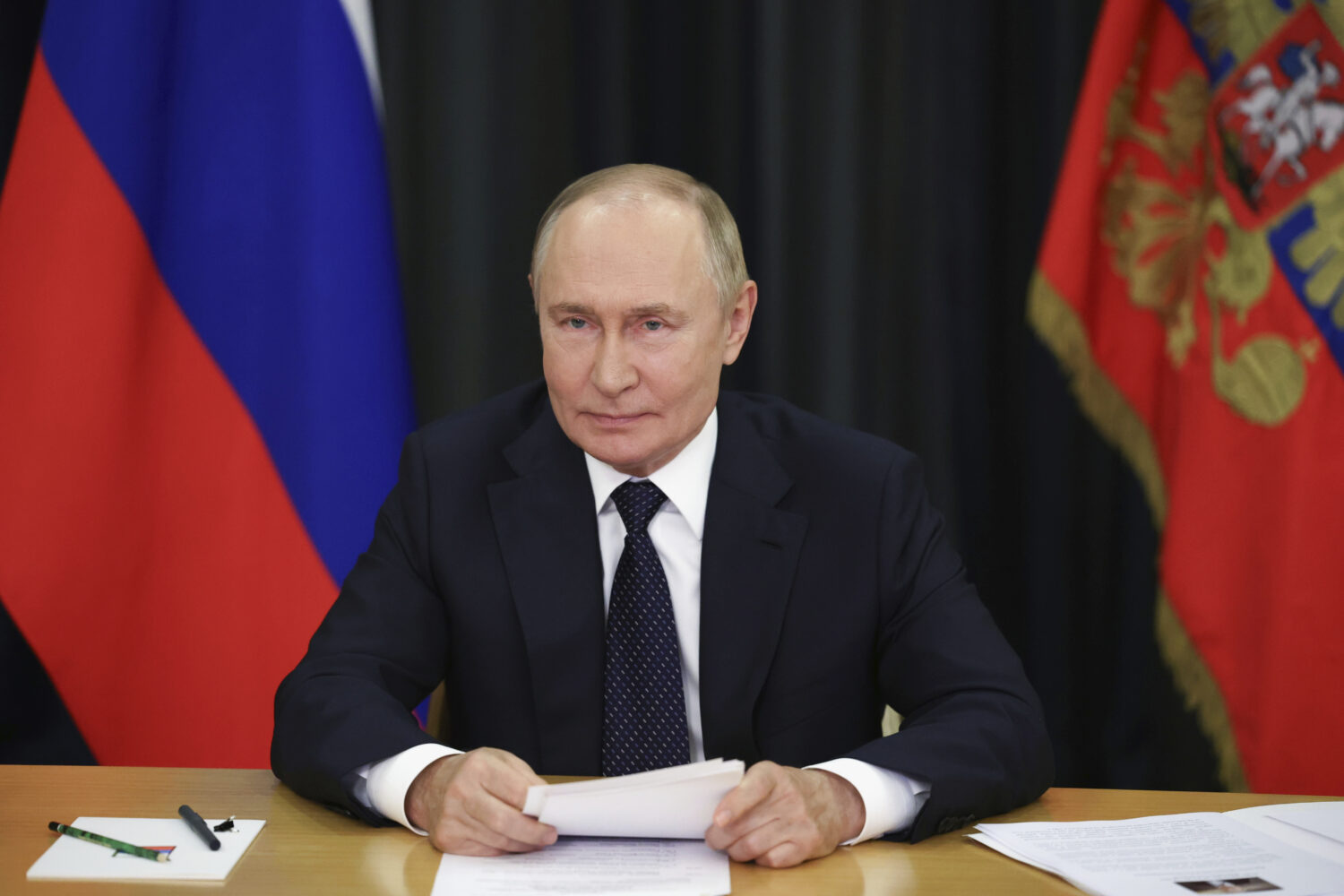 Russian President Vladimir Putin takes part, via videoconference in Sochi, Russia, Monday, Sept. 8,...