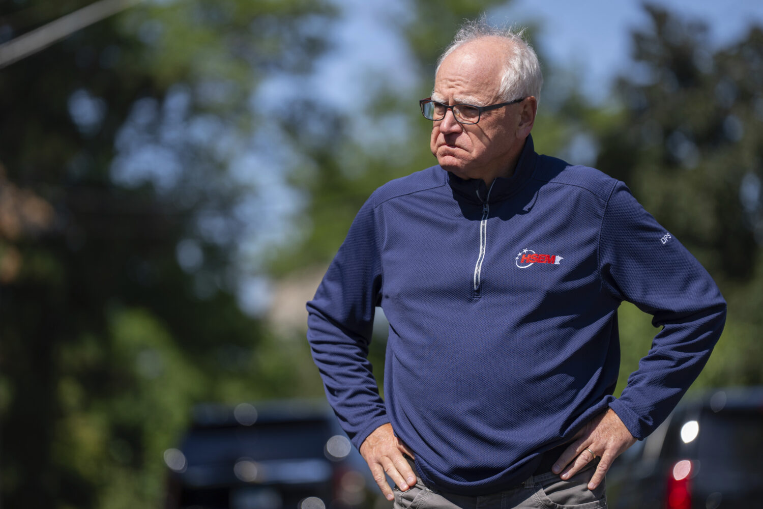 Minnesota Governor Tim Walz waits for a press conference to start outside Annunciation Church after...