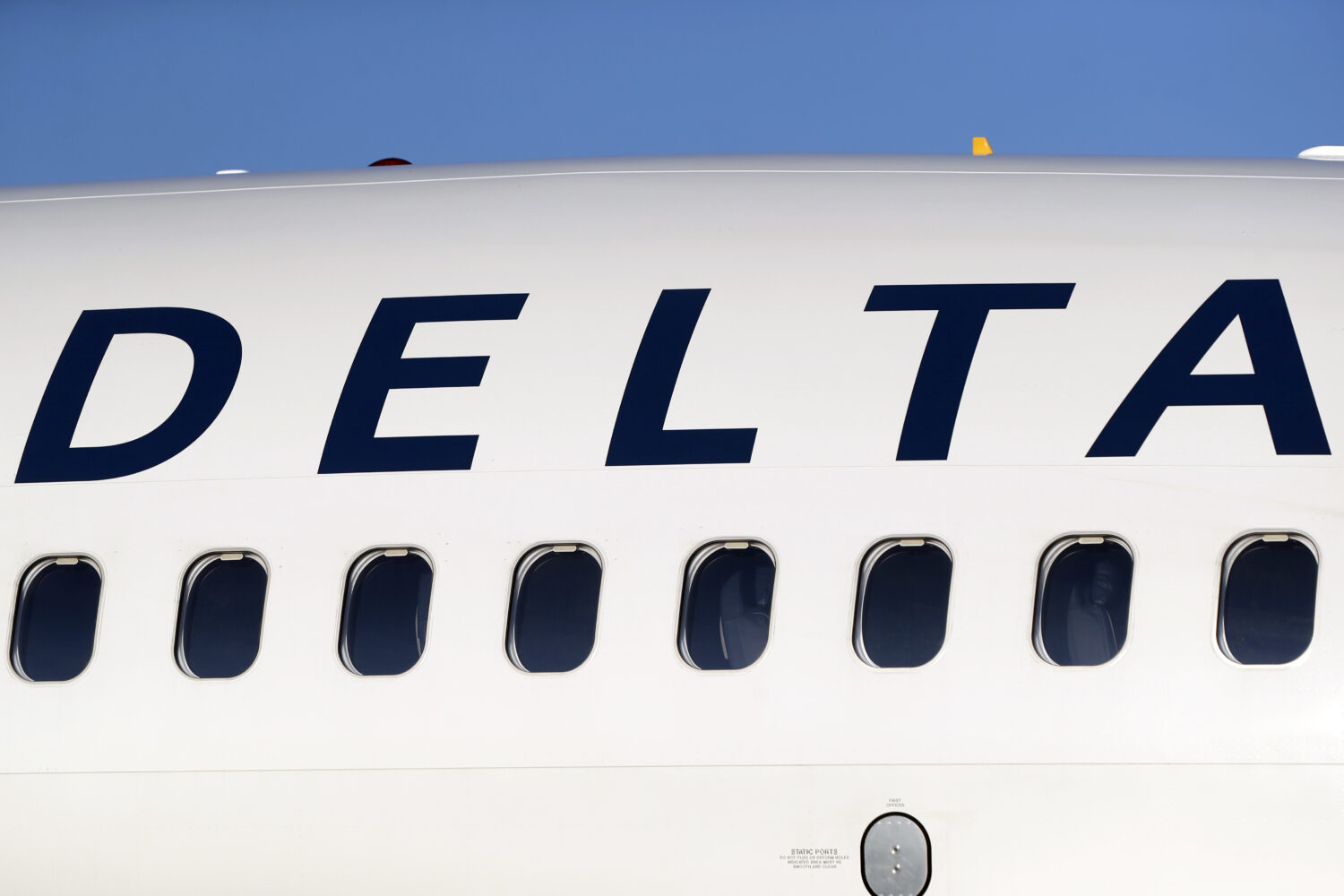 FILE - The company logo graces the side of a Delta Air Lines jetliner at Denver International Airpo...