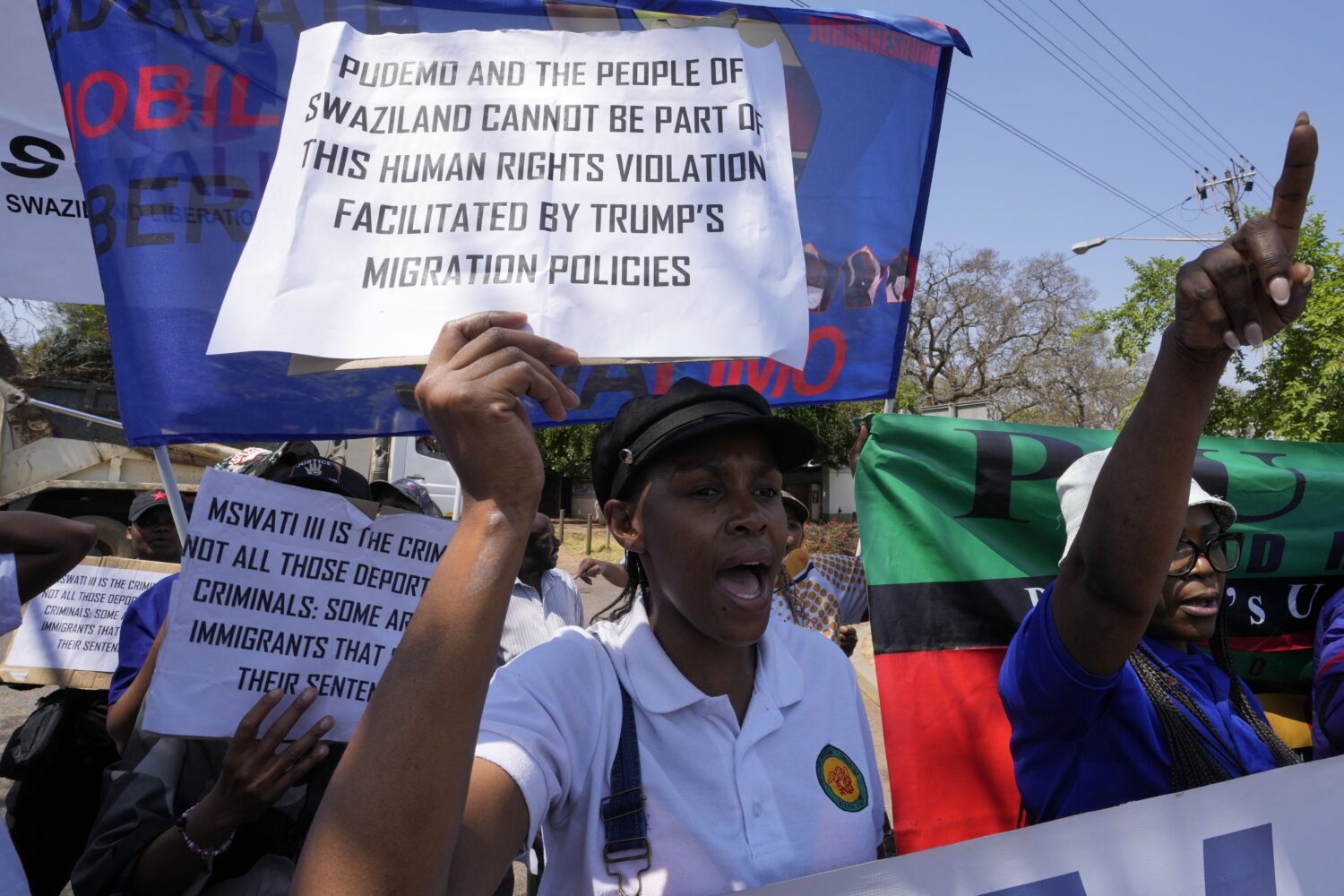 Members of Eswatin Pro-democracy activists, hold placards during their protest outside the U.S. Emb...