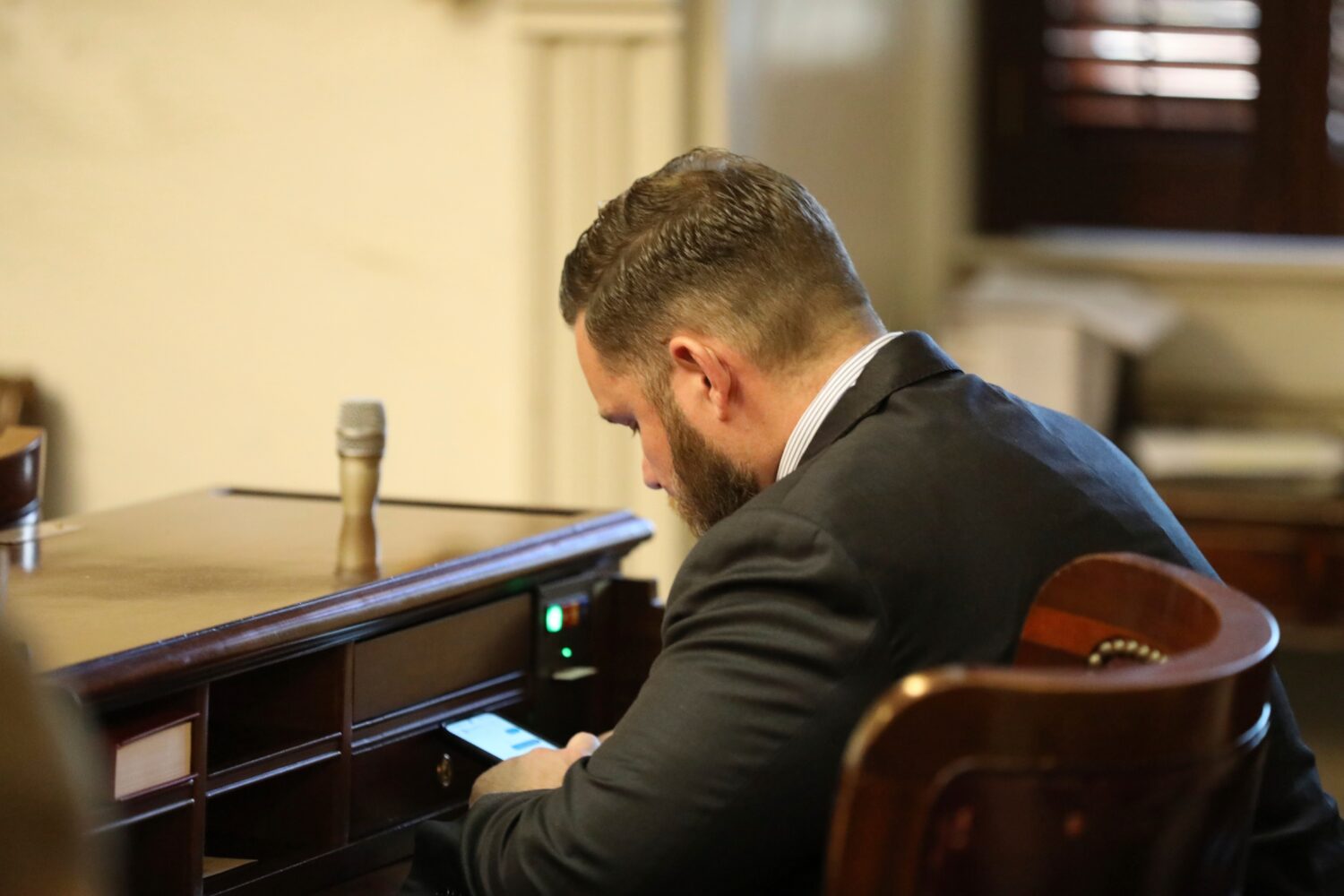 FILE - Republican South Carolina Rep. R.J. May of Lexington sits at his new desk during the organiz...