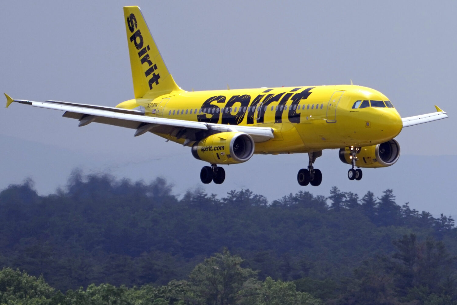 FILE - A Spirit Airlines 319 Airbus approaches Manchester Boston Regional Airport for a landing, Fr...