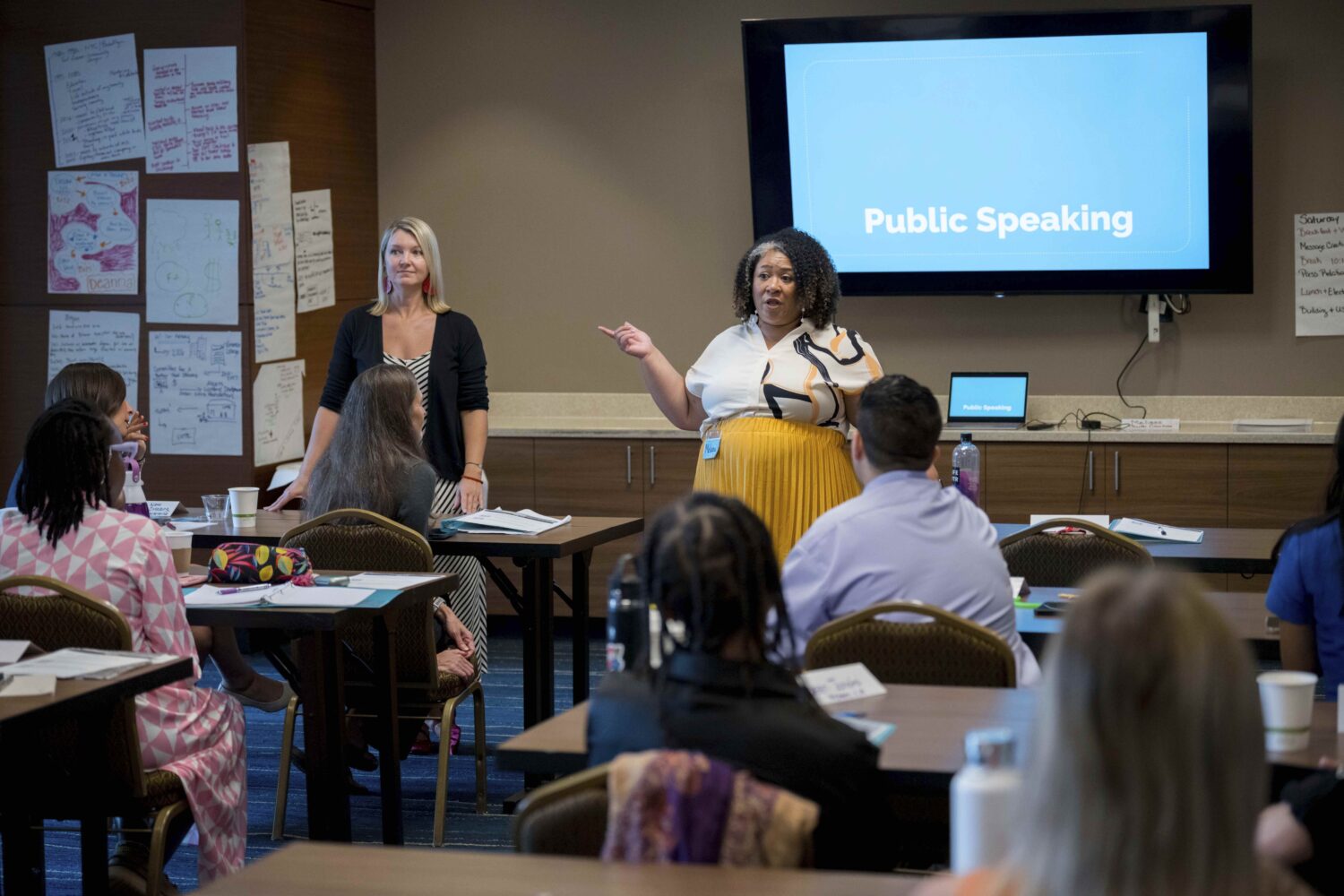 Melissa Watson Ward, training director for Emerge America, center, speaks to present and future can...