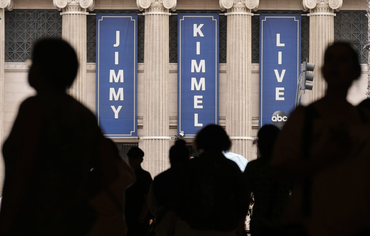 People walk by the Jimmy Kimmel Live studio on Hollywood Blvd., Wednesday, Sept. 17, 2025, in Los A...