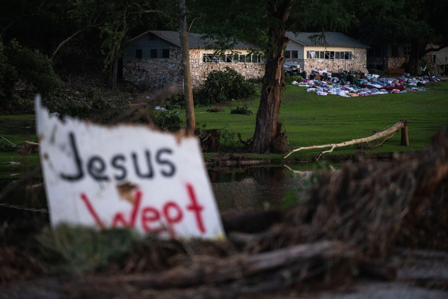 FILE - Campers belongings sit outside one of Camp Mystic's cabins near the Guadalupe River, July 7,...