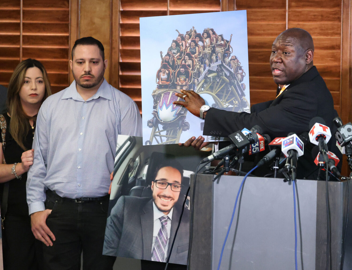 Attorney Benjamin Crump displays a photo of the Epic Universe roller coaster during a press confere...
