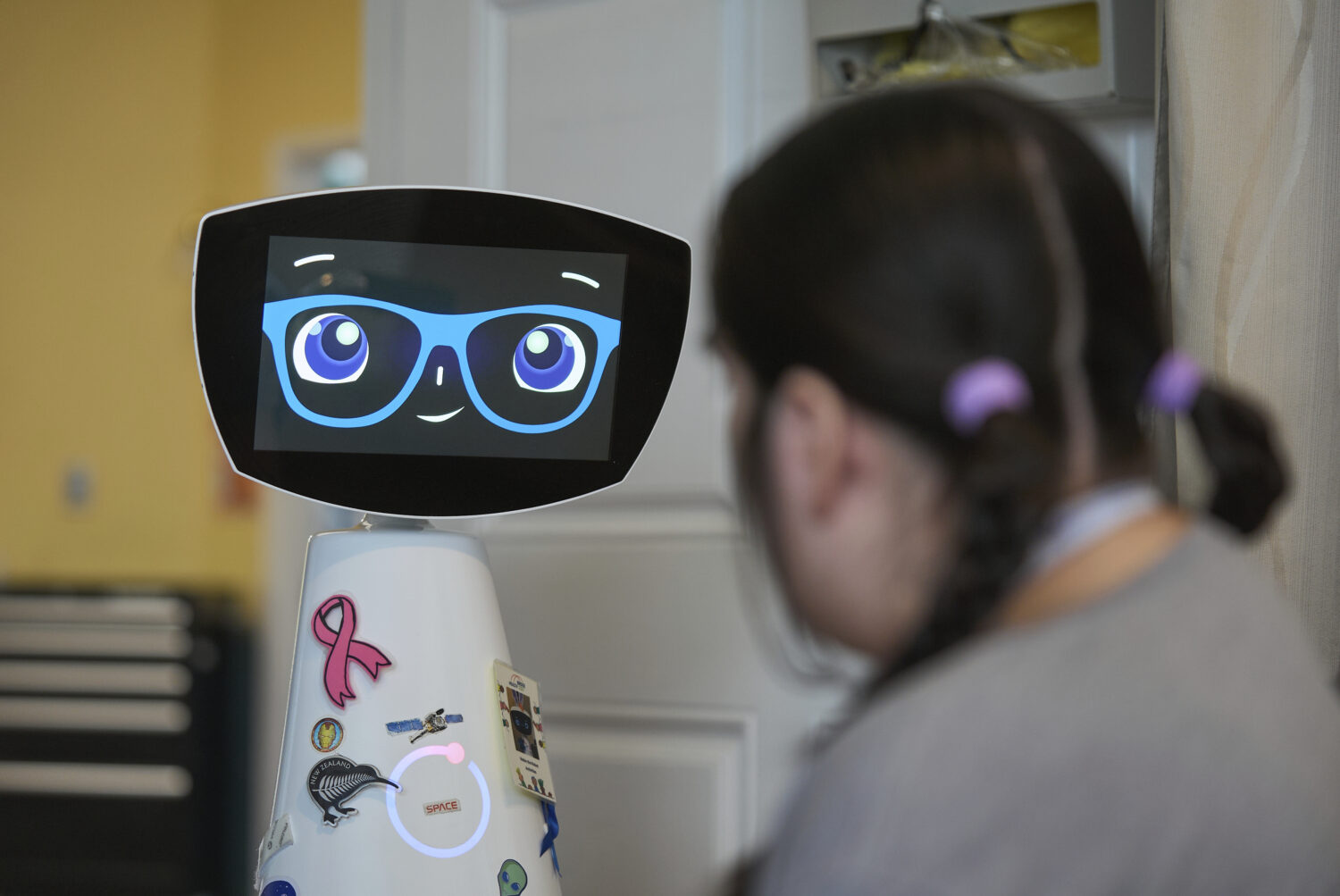 Robin the Robot visits with a patient at the HealthBridge Orange Specialty Pediatric Hospital in Or...