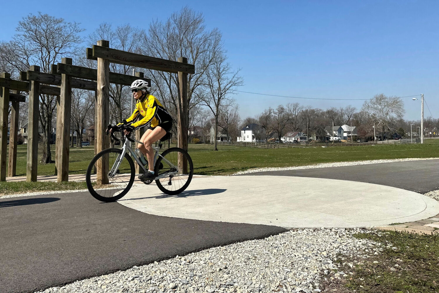 FILE - A cyclist rides along the Cardinal Greenway in Muncie, Indiana, March 13, 2024. (AP Photo/Is...