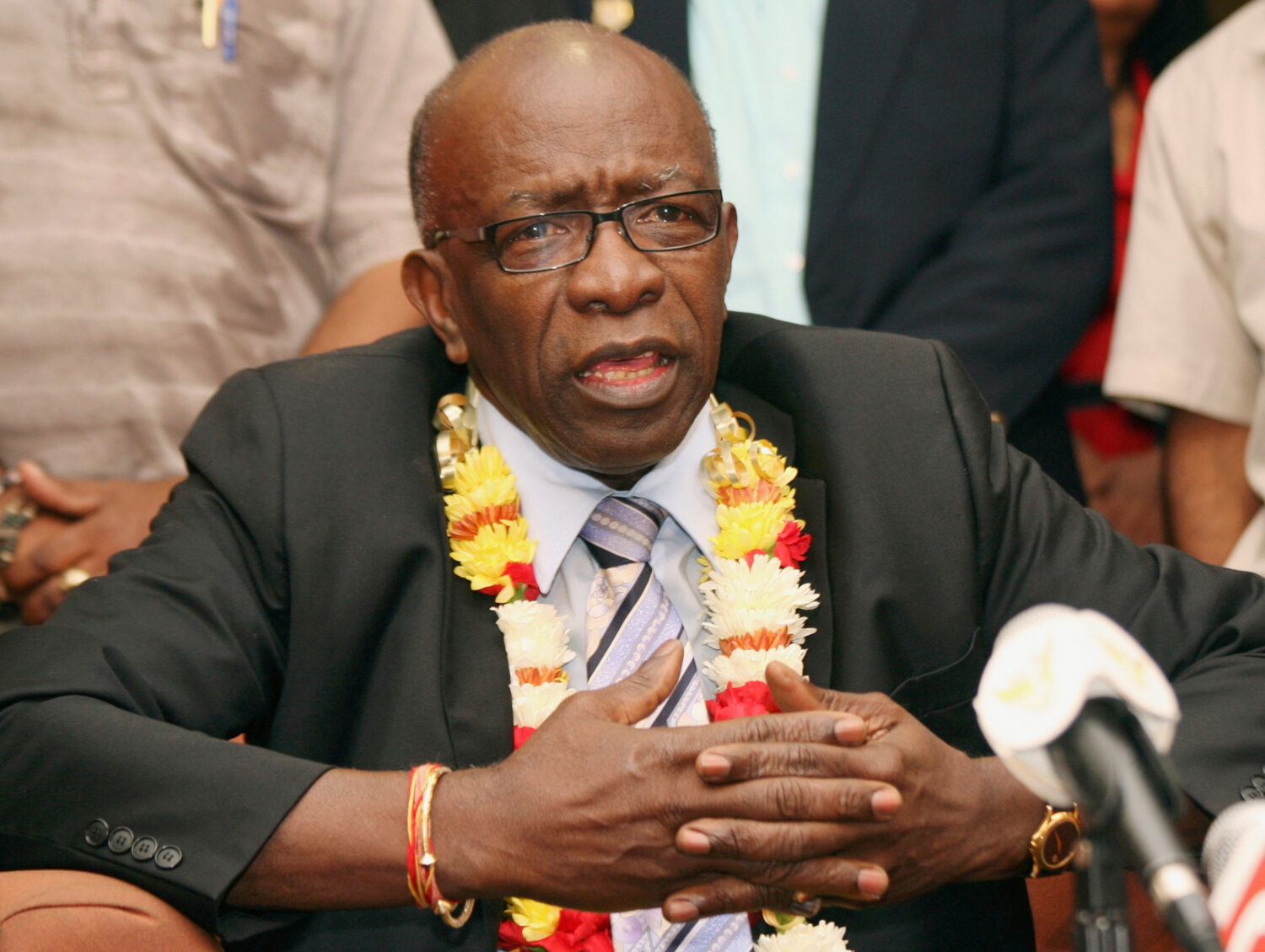 FILE - Suspended FIFA executive Jack Warner gestures during a news conference at the airport in Por...