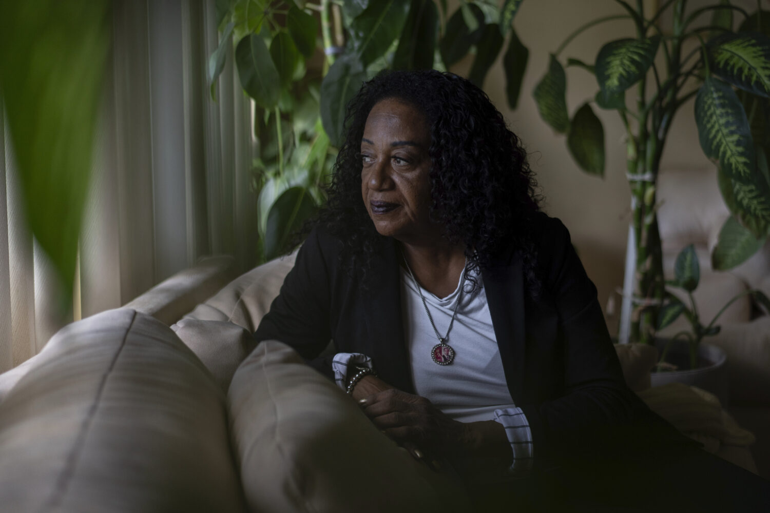 Delphine Cherry looks out from her favorite spot in her home Friday, Sept. 5, 2025, in Hazel Crest,...