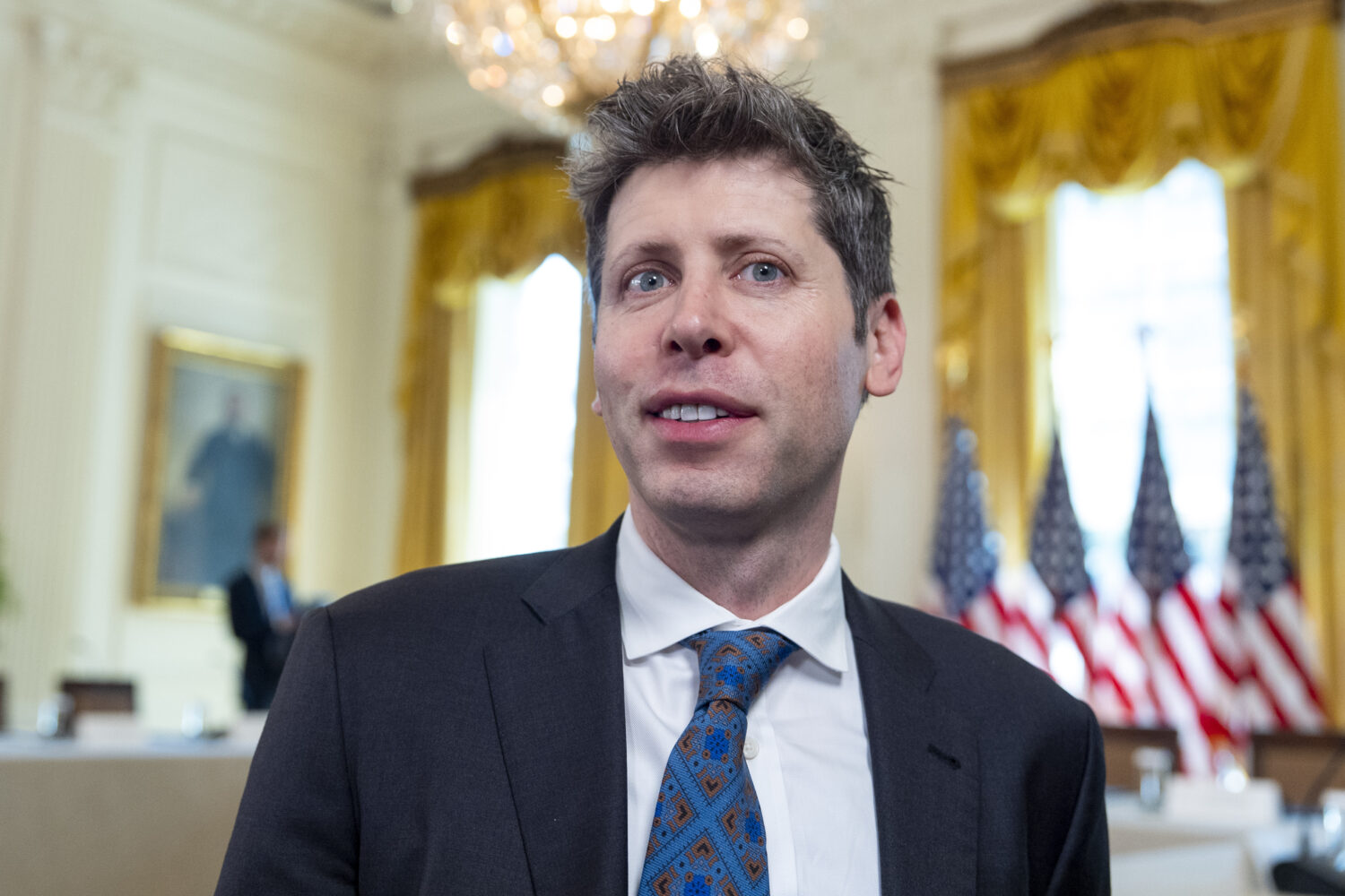 Sam Altman, CEO of OpenAI, takes his seat before a meeting of the White House Task Force on Artific...