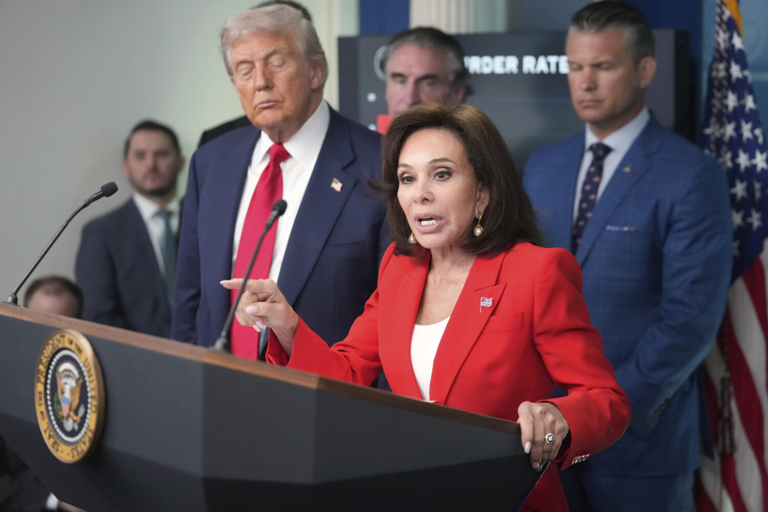 U.S. Attorney Jeanine Pirro speaks with reporters as President Donald Trump, from left, Interior Se...