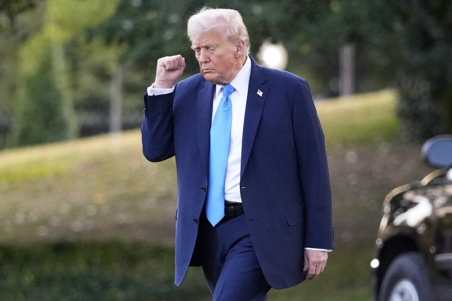 President Donald Trump walks across the South Lawn of the White House to board Marine One en route ...