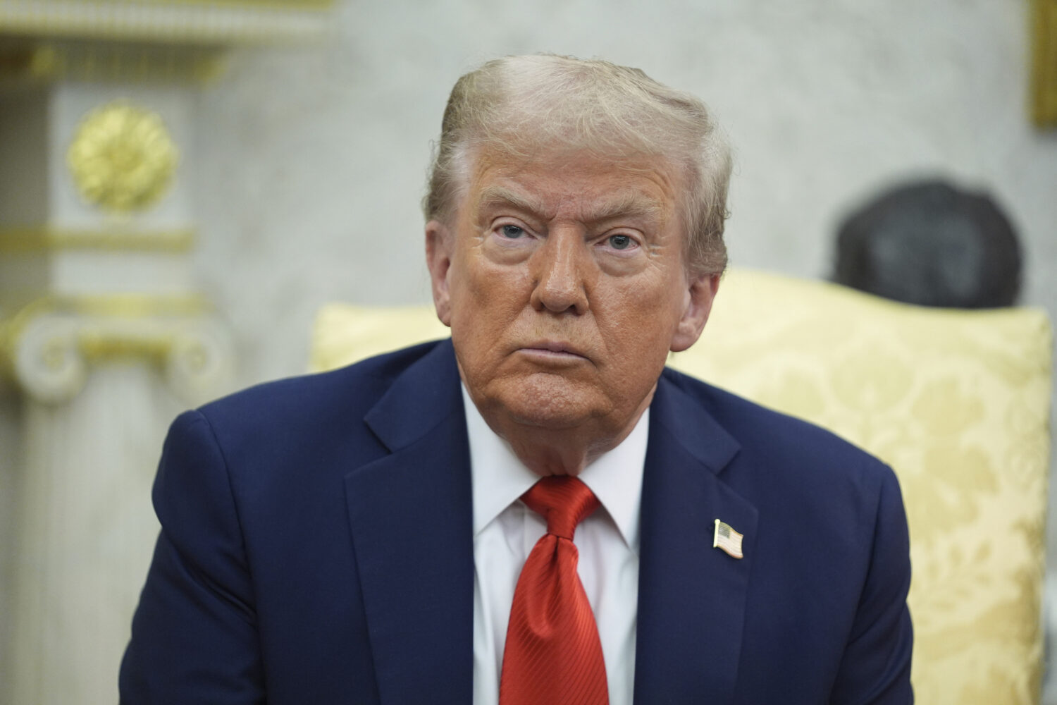 President Donald Trump listens during a meeting with Polish President Karol Nawrocki in the Oval Of...