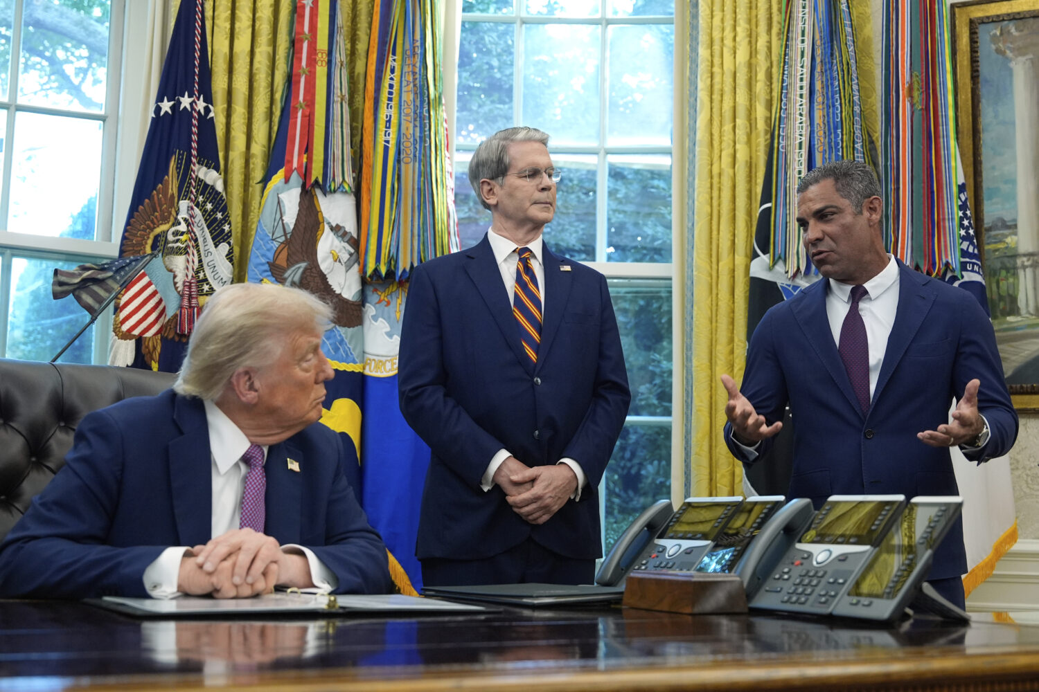 President Donald Trump listens as Miami Mayor Francis Suarez speaks in the Oval Office of the White...