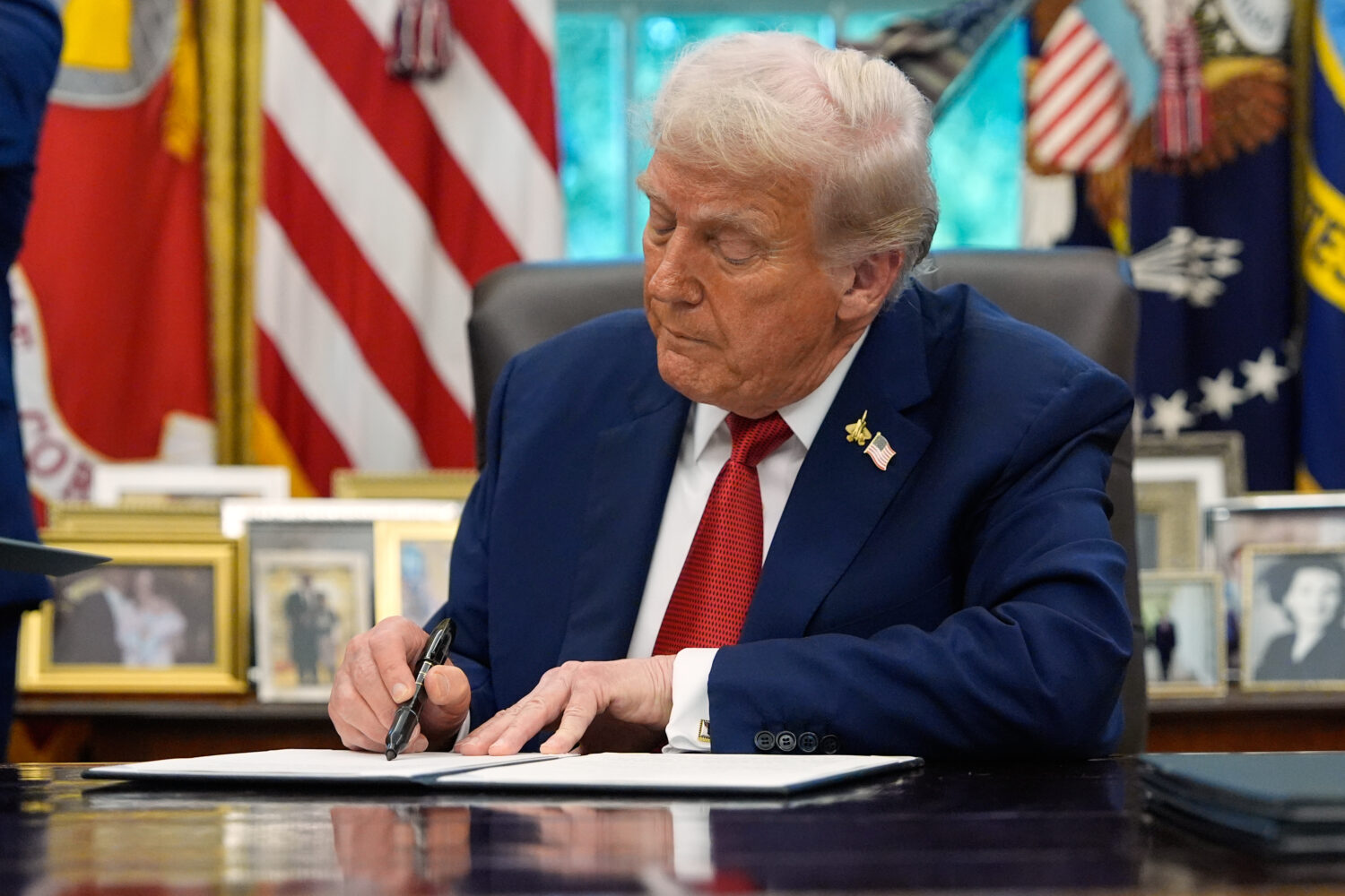 President Donald Trump signs a presidential memorandum on the death penalty in the District of Colu...