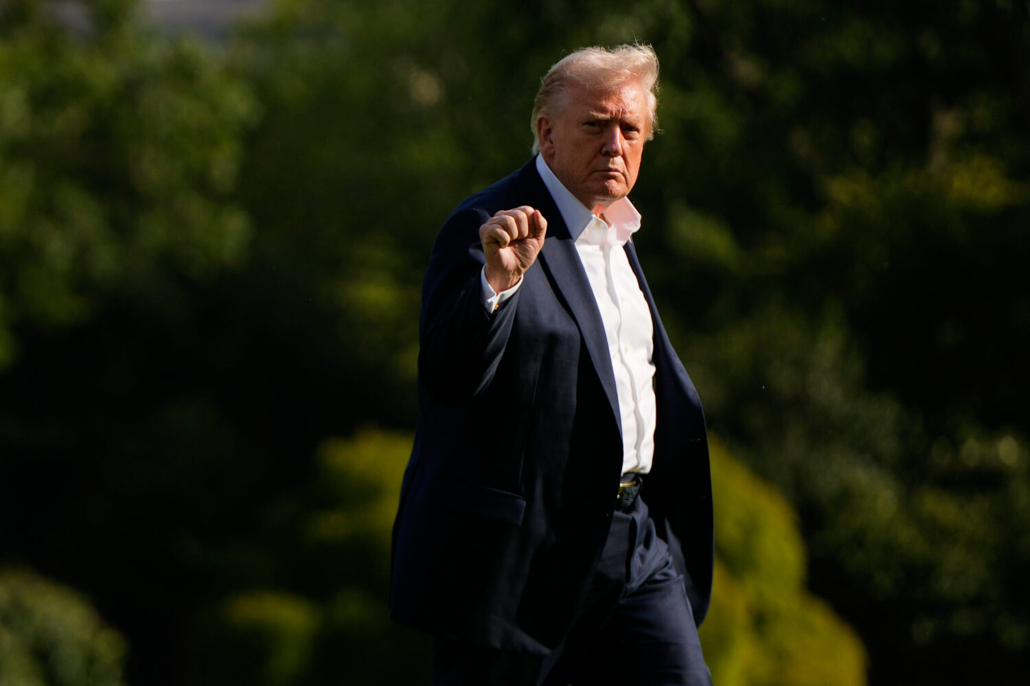 President Donald Trump gestures as he arrives at the White House, Friday, Sept. 26, 2025, in Washin...