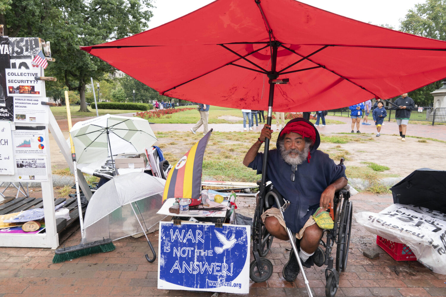 Philipos Melaku-Bello talks to people during Peace Vigil in Lafayette Park across from the White Ho...