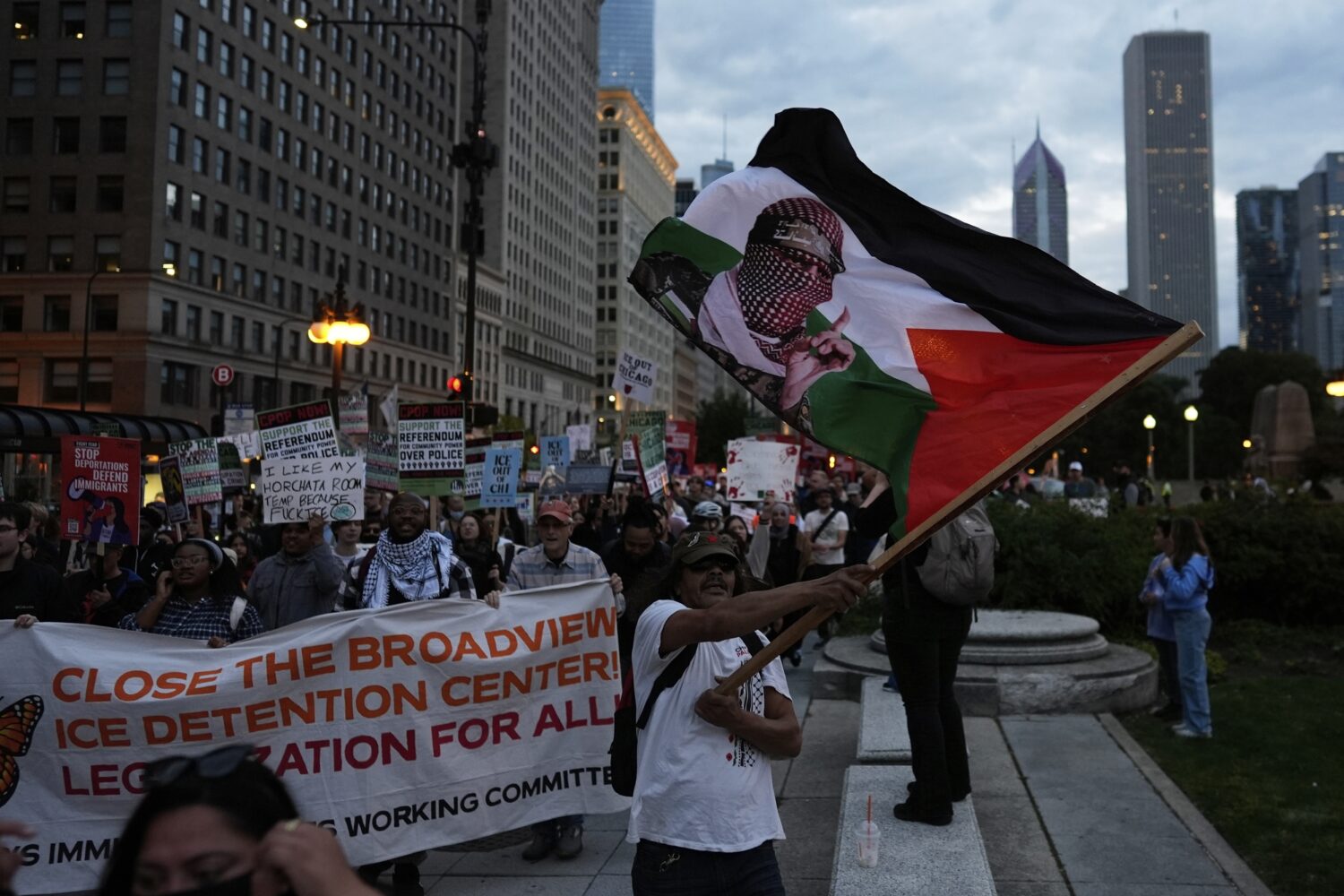 People march during Illinois Coalition for Immigrant & Refugee Rights' "Chicago Says No Trump No Tr...