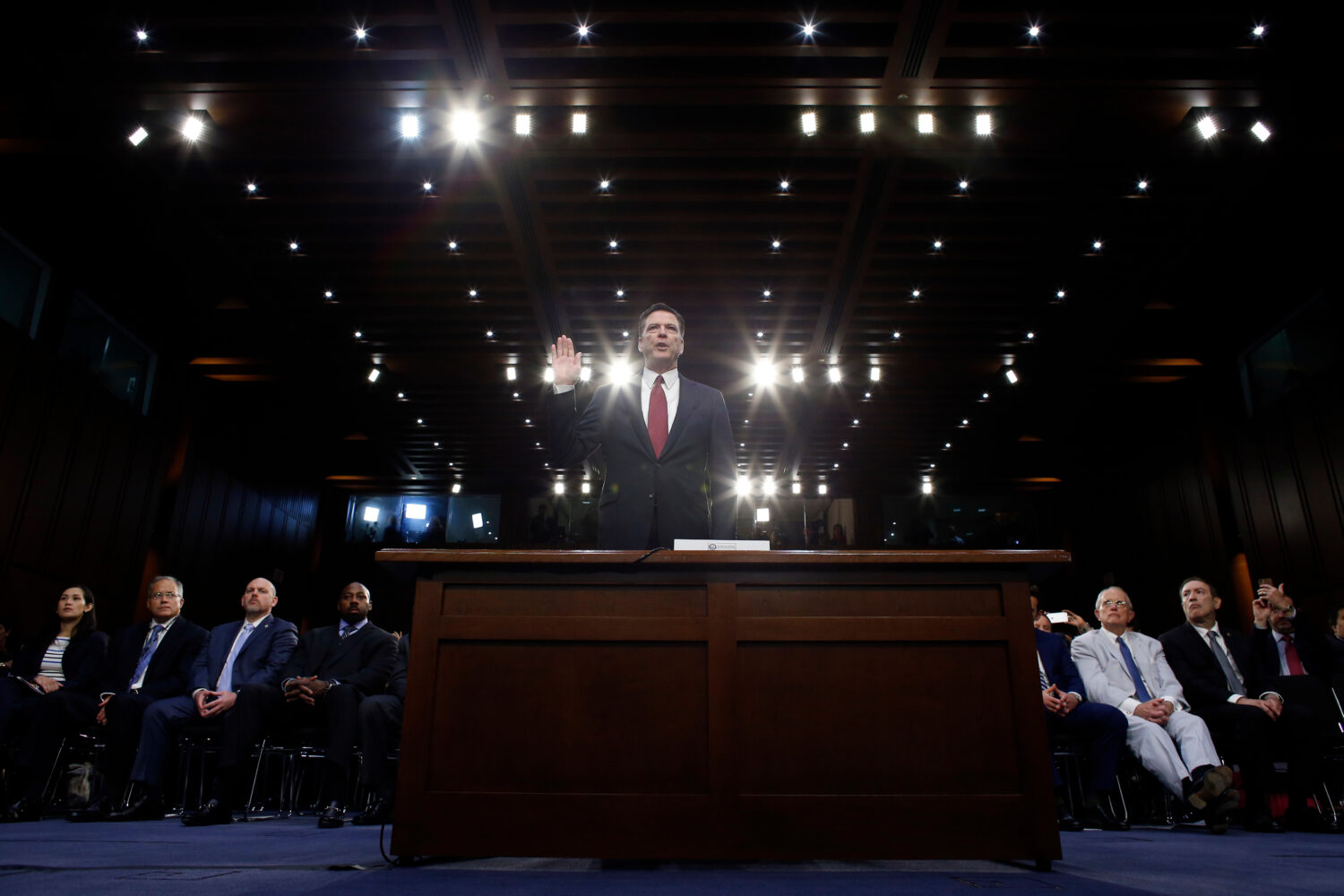 FILE - Former FBI Director James Comey is sworn in during a Senate Intelligence Committee hearing o...