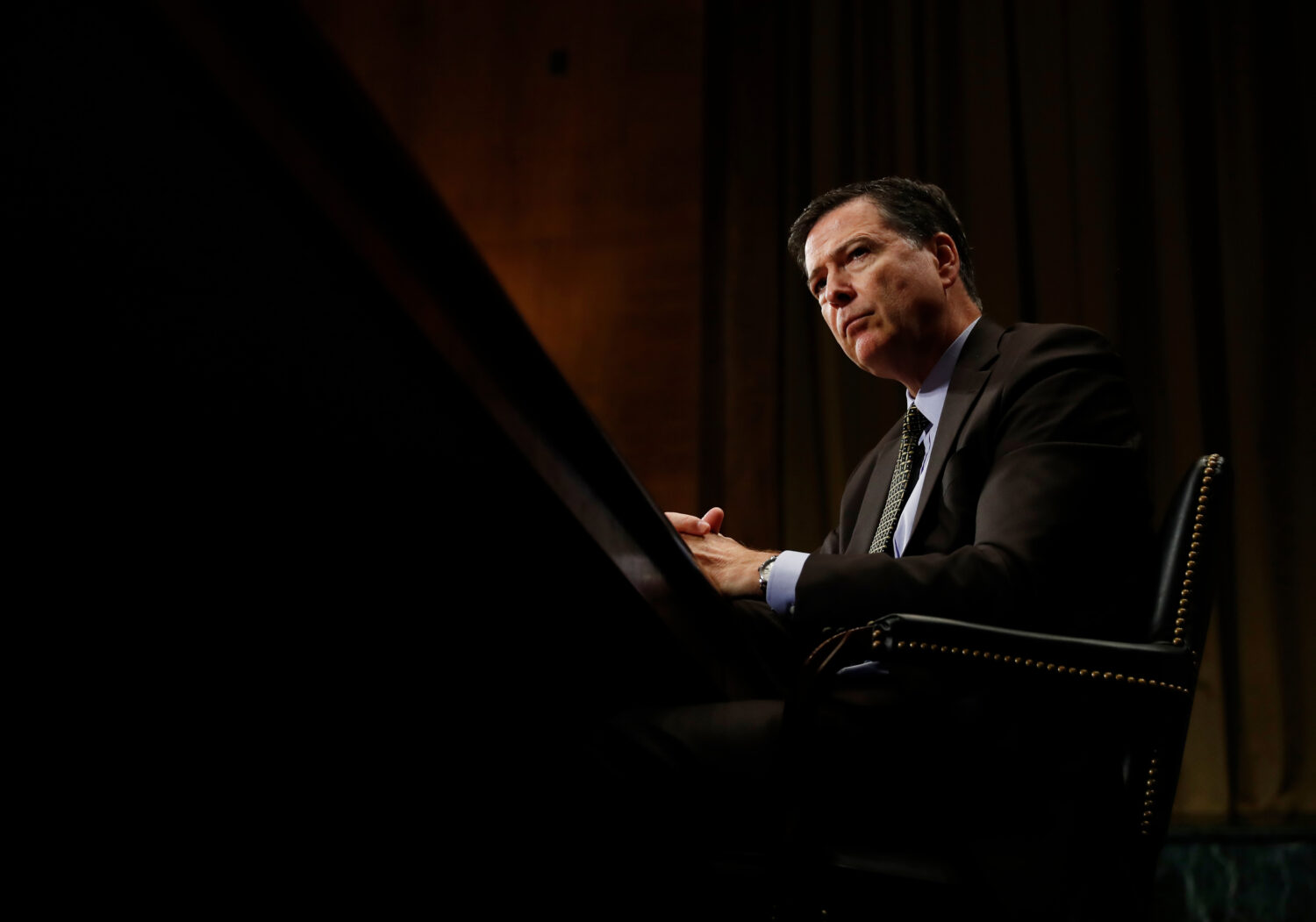 FILE - FBI Director James Comey pauses as he testifies on Capitol Hill in Washington, May 3, 2017, ...