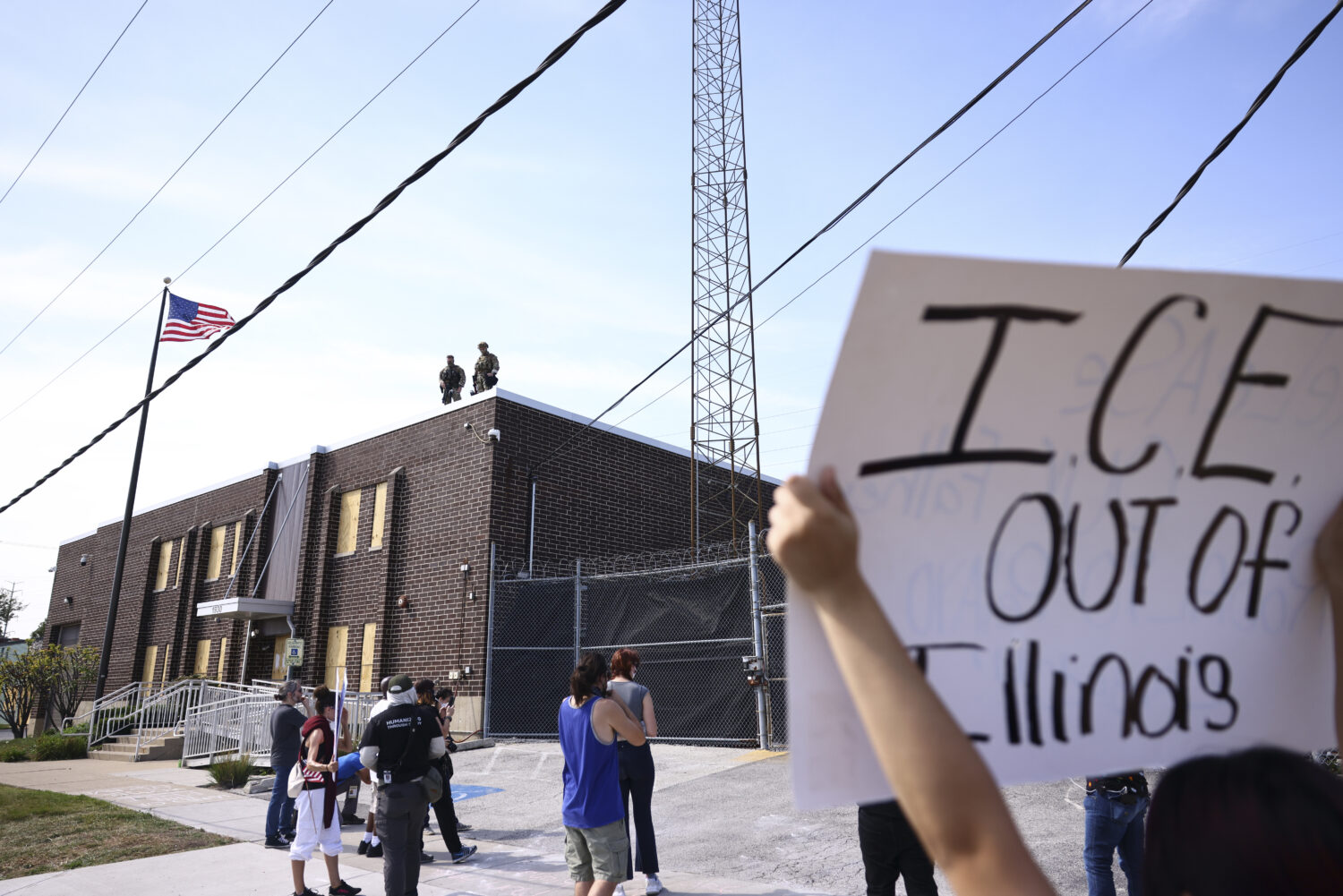 Immigration and Customs Enforcement facility officers stand guard outside an ICE facility in Broadv...
