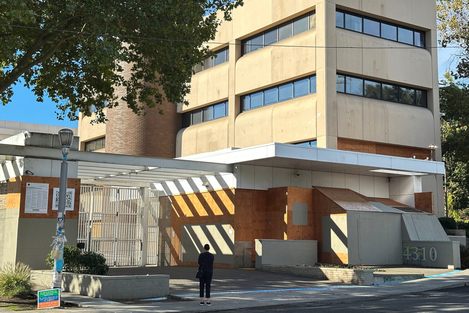 A person stands outside a U.S. Immigration and Customs Enforcement facility on Saturday, Sept. 27, ...
