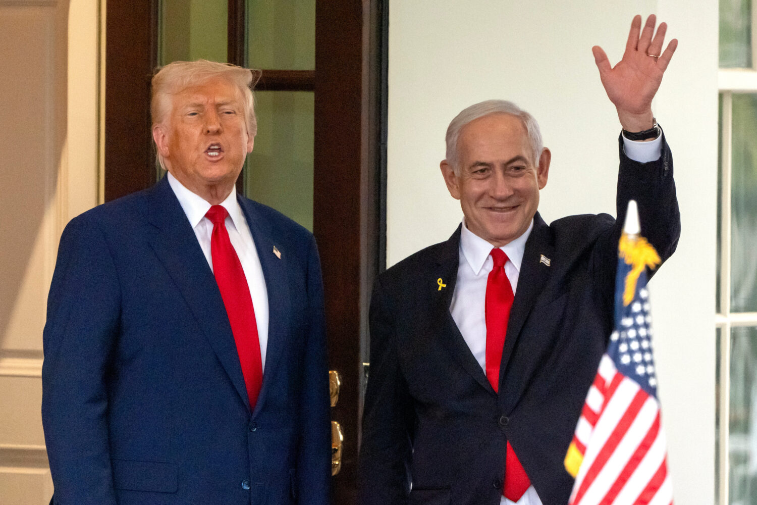 FILE - President Donald Trump, left, speaks as Israel's Prime Minister Benjamin Netanyahu waves upo...
